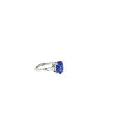 Platinum 3.50ct Oval Shaped AAA Tanzanite and Surround by .30ct F VS2 Baguette Diamond Ring