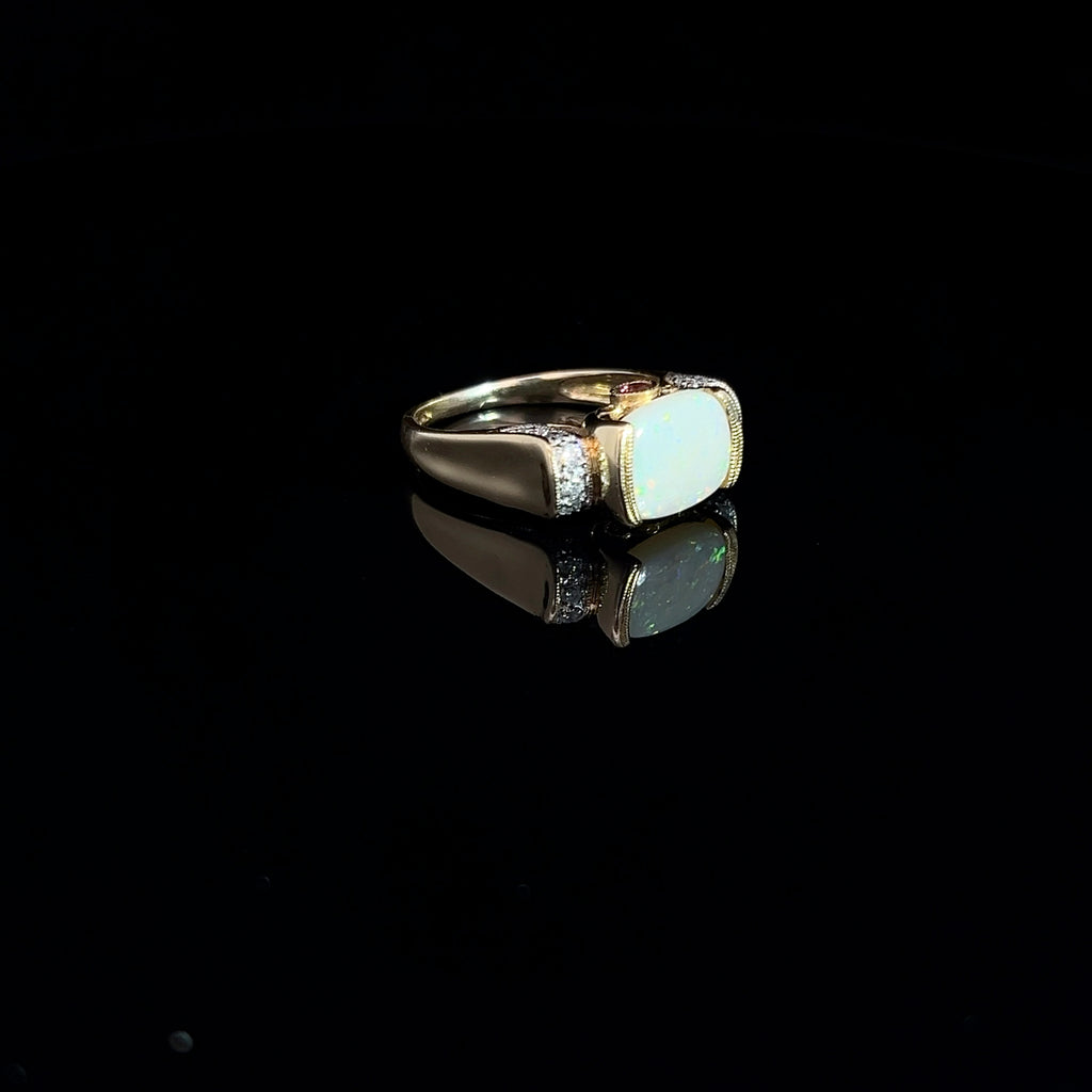 14k Yellow Gold 2.00ct Oval Opal/ .12ct Round Diamond and .10ct Round Rhodolite Garnet Ring