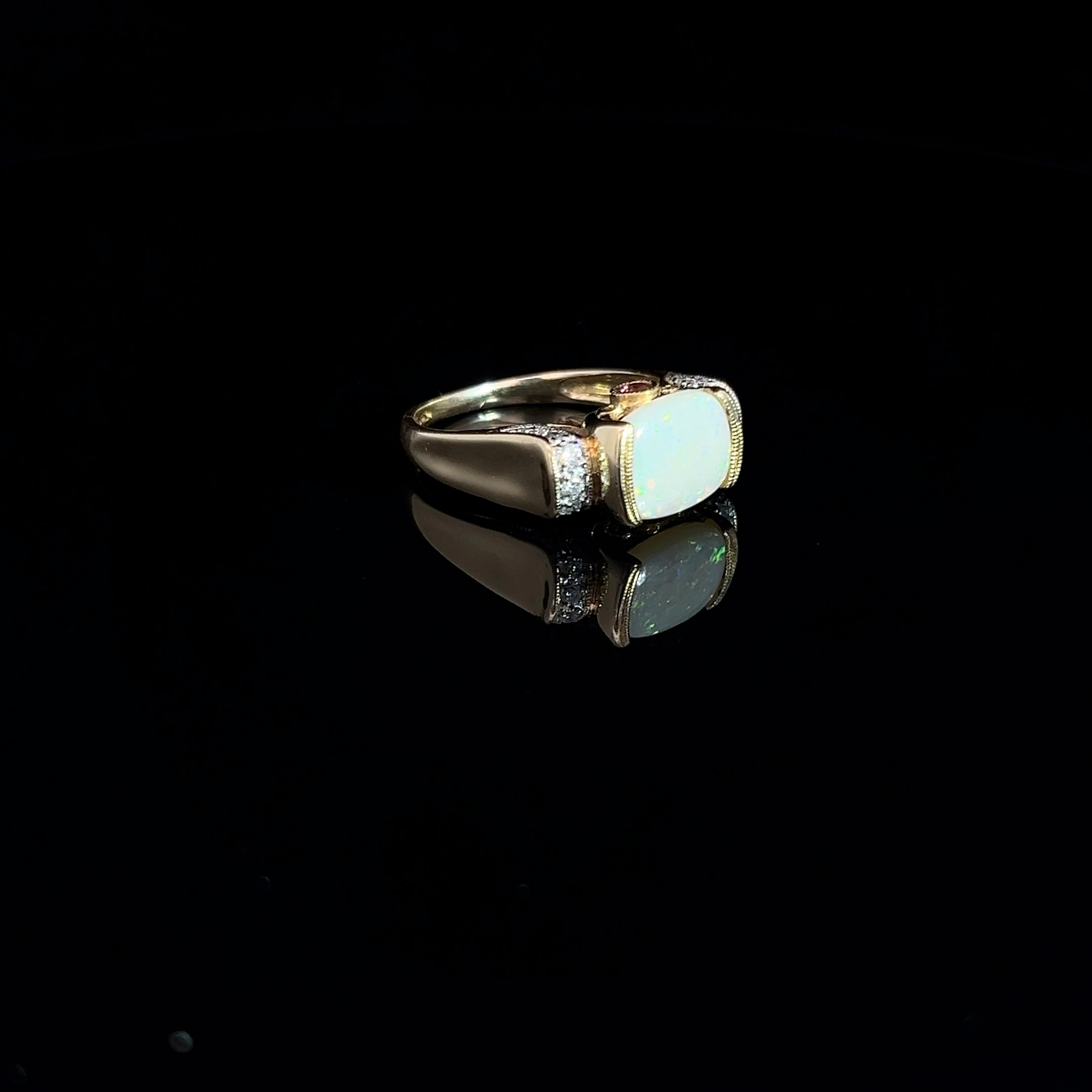 14k Yellow Gold 2.00ct Oval Opal/ .12ct Round Diamond and .10ct Round Rhodolite Garnet Ring