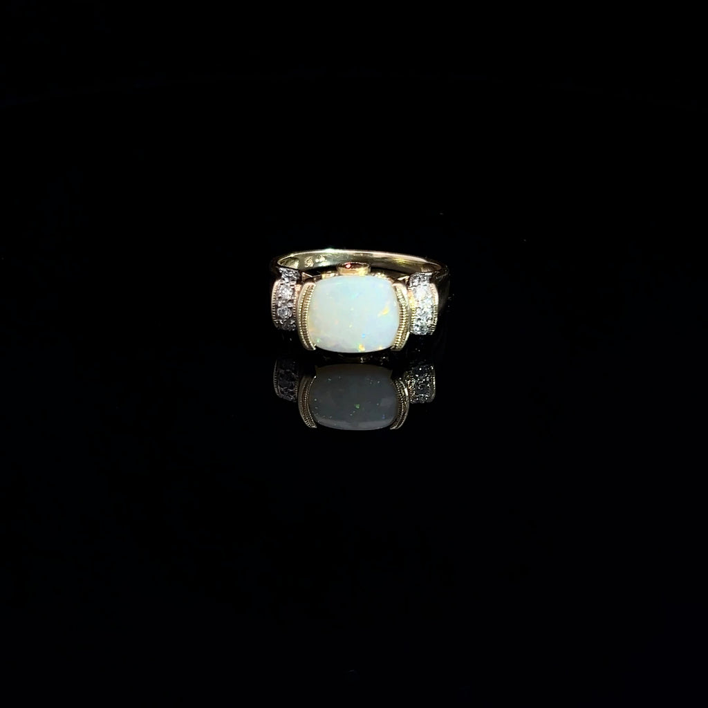 14k Yellow Gold 2.00ct Oval Opal/ .12ct Round Diamond and .10ct Round Rhodolite Garnet Ring