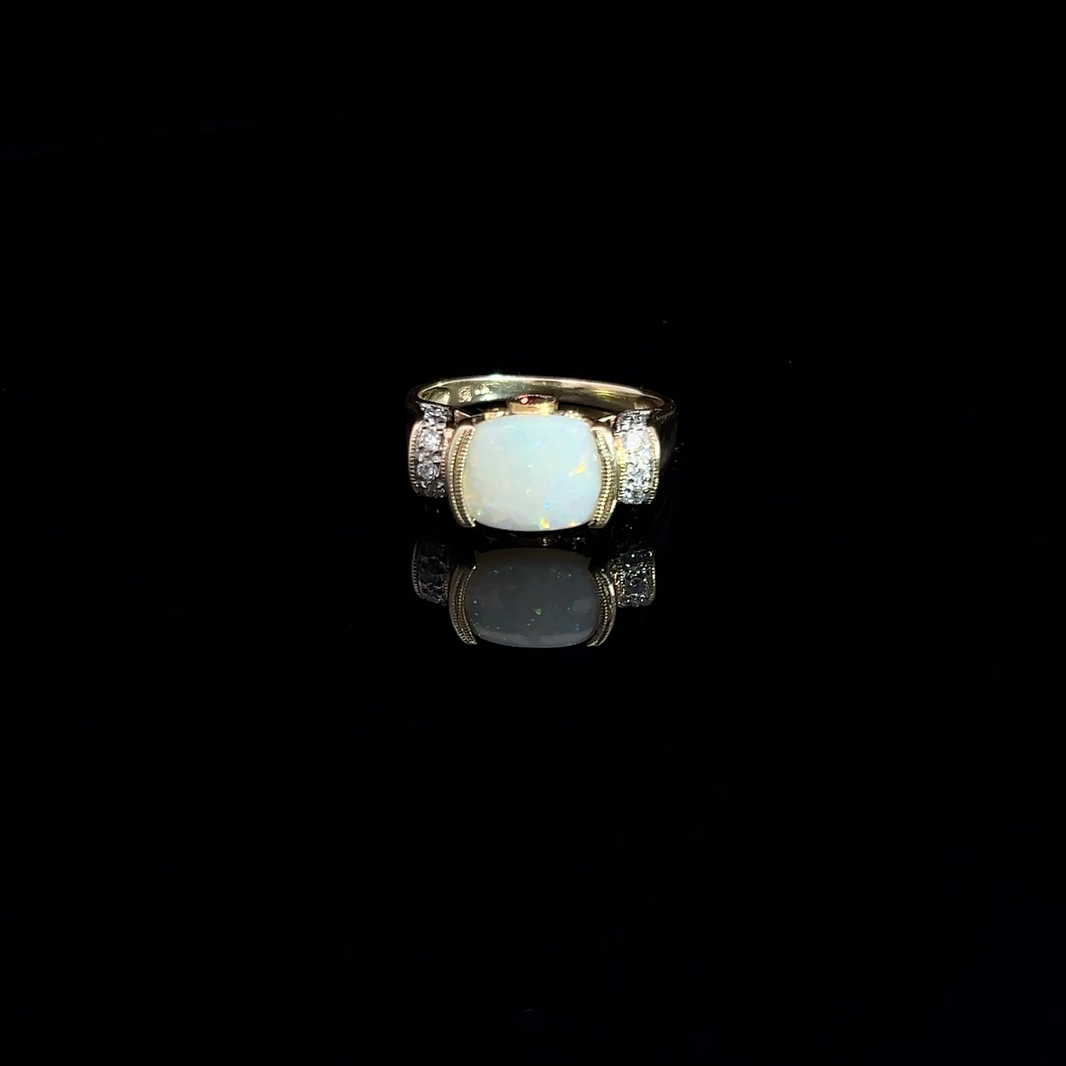 14k Yellow Gold 2.00ct Oval Opal/ .12ct Round Diamond and .10ct Round Rhodolite Garnet Ring