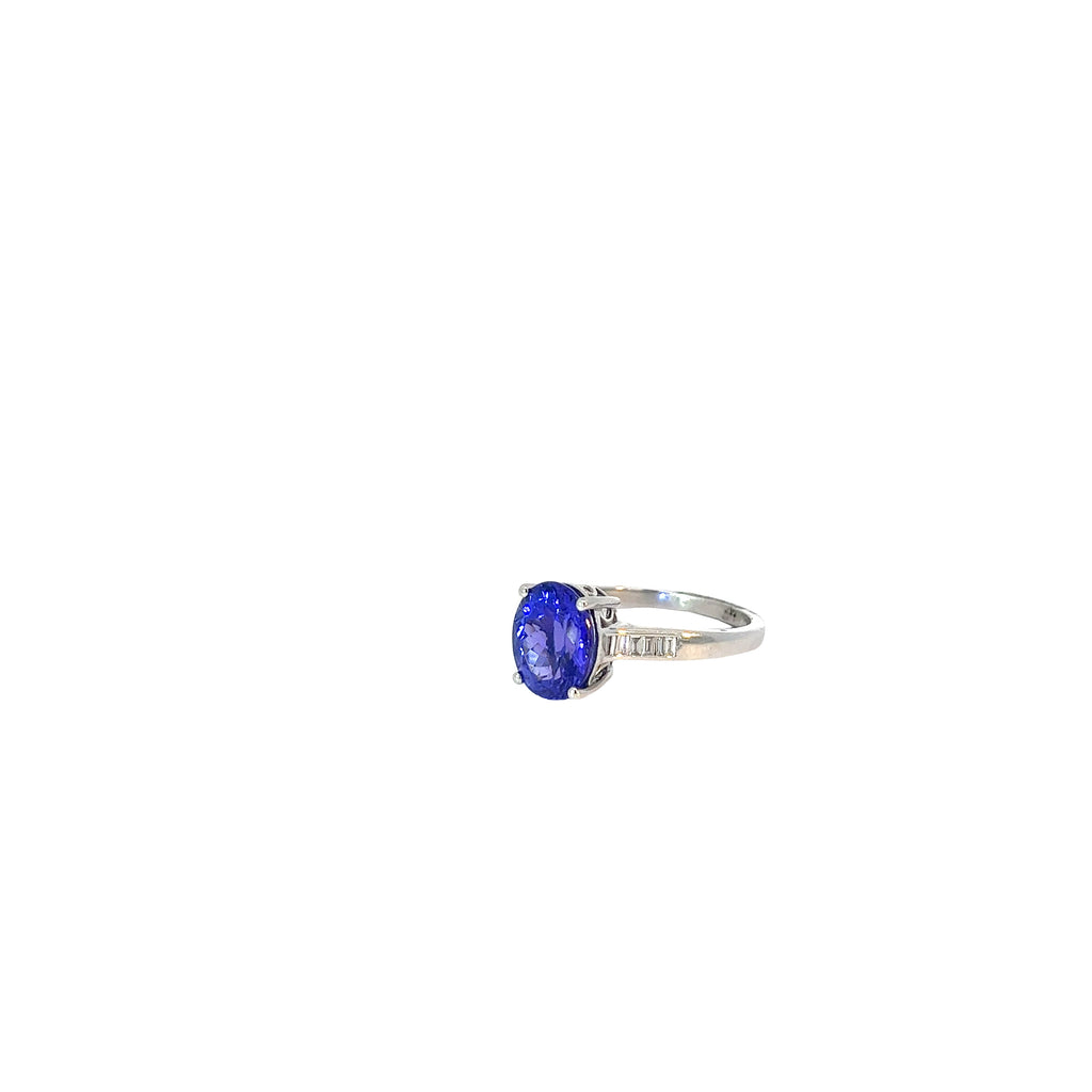 Platinum 3.50ct Oval Shaped AAA Tanzanite and Surround by .30ct F VS2 Baguette Diamond Ring