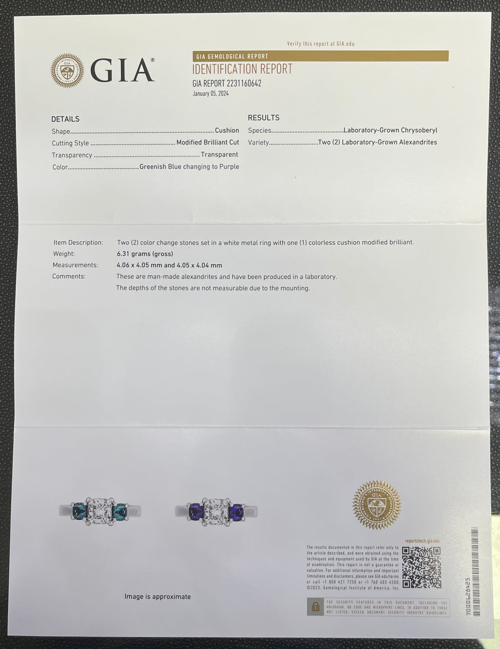PLATINUM 1.08CT F VS1 CUSHION SET IN A PAST, PRESENT AND FUTURE MOUNTING WITH TWO ROUND LABORATORY GROWN ALEXANDRITES CERTIFIED BY GIA #5234160482 FOR CUSHION  AND GIA #2231160642 FOR ROUND ALEXANDRITES