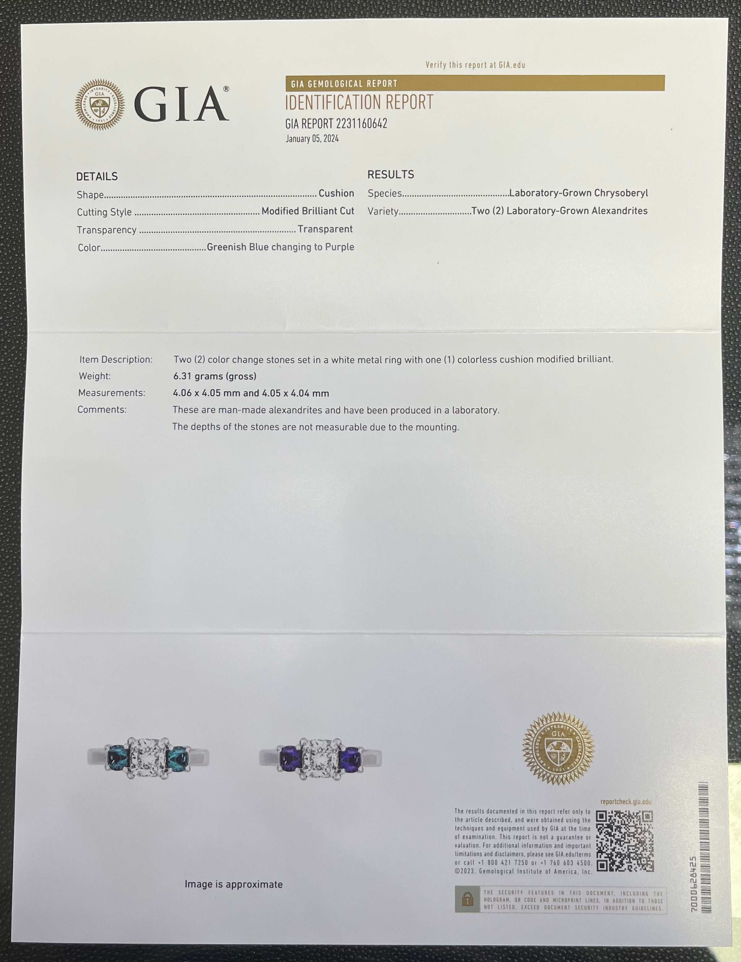 PLATINUM 1.08CT F VS1 CUSHION SET IN A PAST, PRESENT AND FUTURE MOUNTING WITH TWO ROUND LABORATORY GROWN ALEXANDRITES CERTIFIED BY GIA #5234160482 FOR CUSHION  AND GIA #2231160642 FOR ROUND ALEXANDRITES