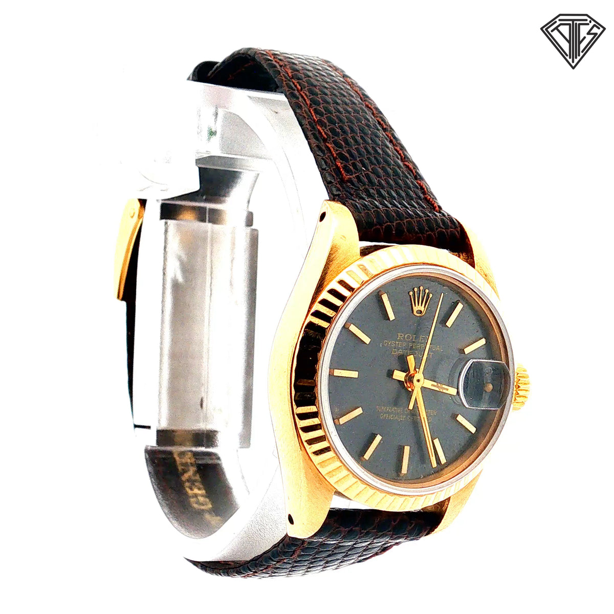 Pre-Owned Vintage Rolex Oyster Perpetual Date Just / 18k Yellow Gold/ Automatic/ 26mm/ Gray Sun Burst Dial/ 18k Yellow Gold Fluted Bezel/ Crystal Acrylic with Cyclops Date Magnifier/ Brown Textured Leather Strap