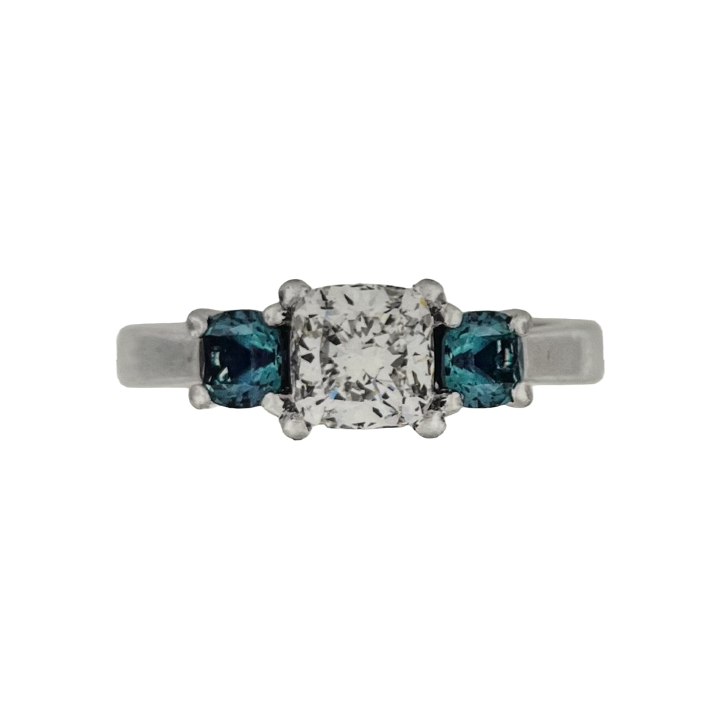 PLATINUM 1.08CT F VS1 CUSHION SET IN A PAST, PRESENT AND FUTURE MOUNTING WITH TWO ROUND LABORATORY GROWN ALEXANDRITES CERTIFIED BY GIA #5234160482 FOR CUSHION  AND GIA #2231160642 FOR ROUND ALEXANDRITES