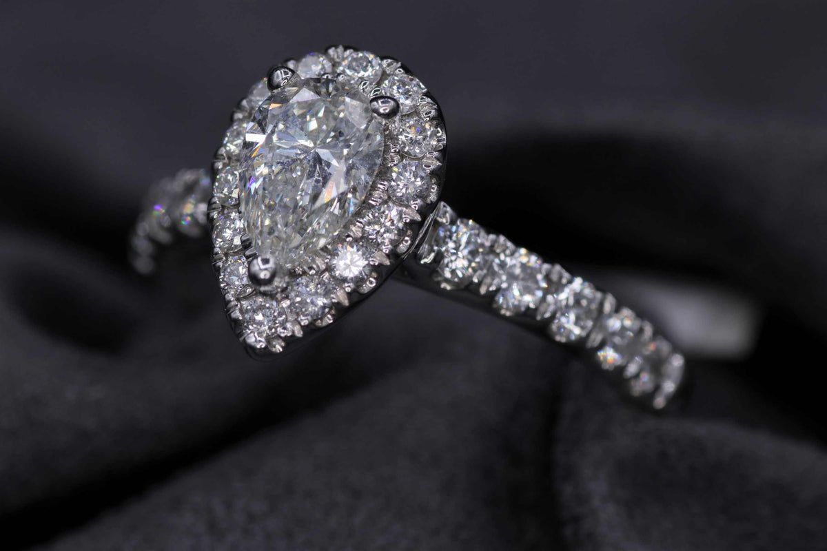 Ladies 14k white gold pear shaped diamond engagement ring
