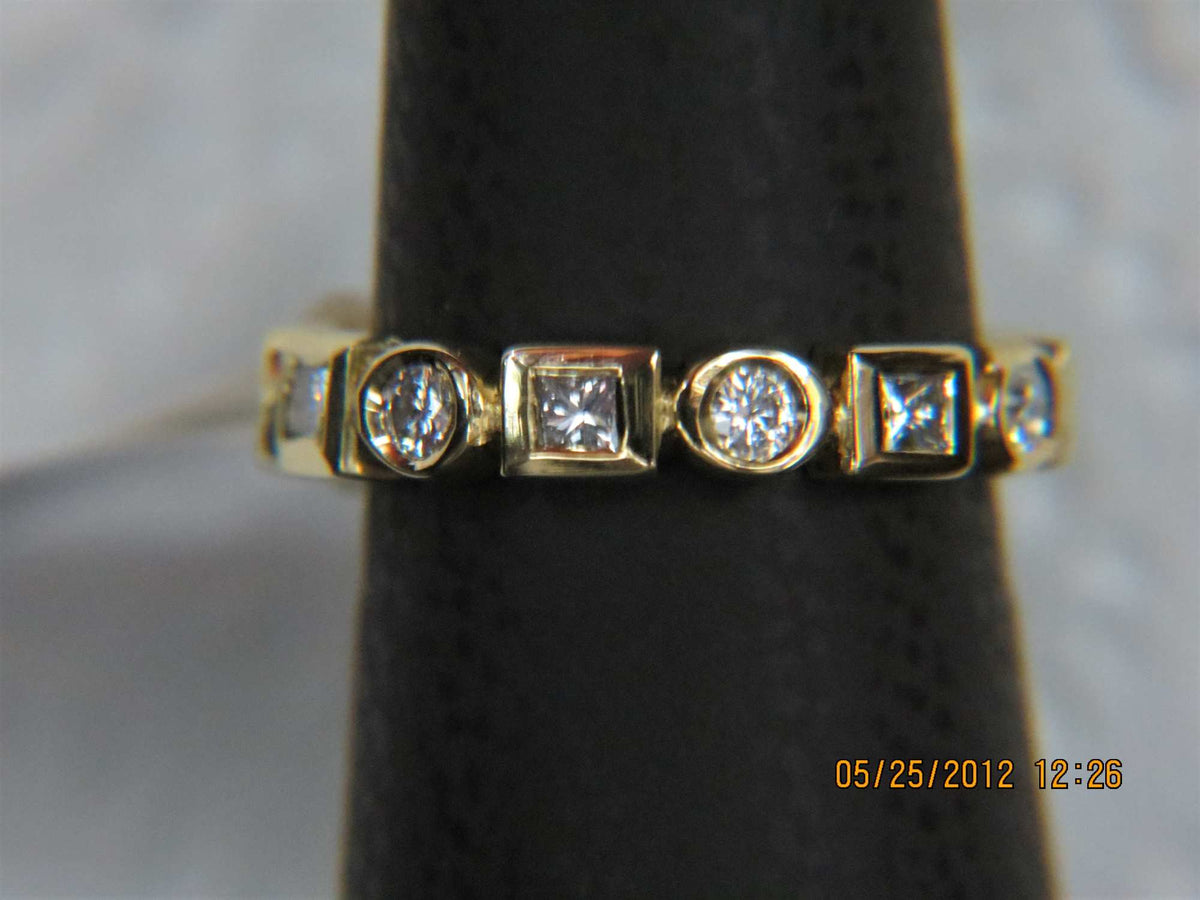 Ladies 18k Rose Gold Round and square bezeled diamond eternity ring