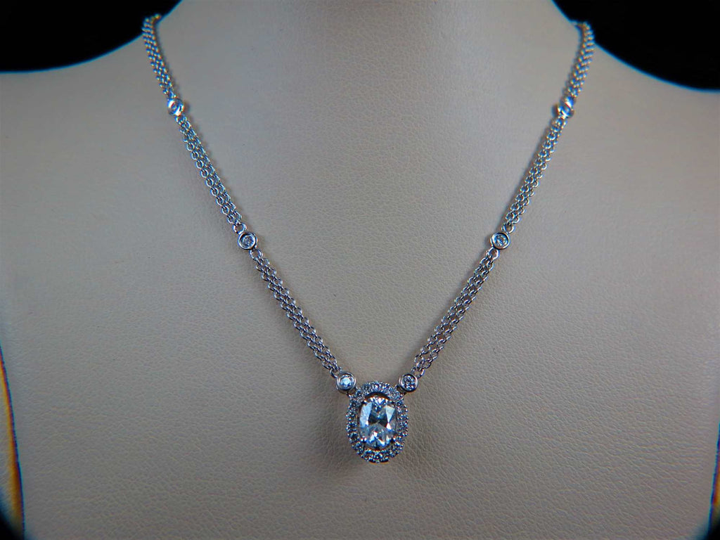 Ladies 18k white gold Oval diamond shaped solitaire necklace with diamond halo