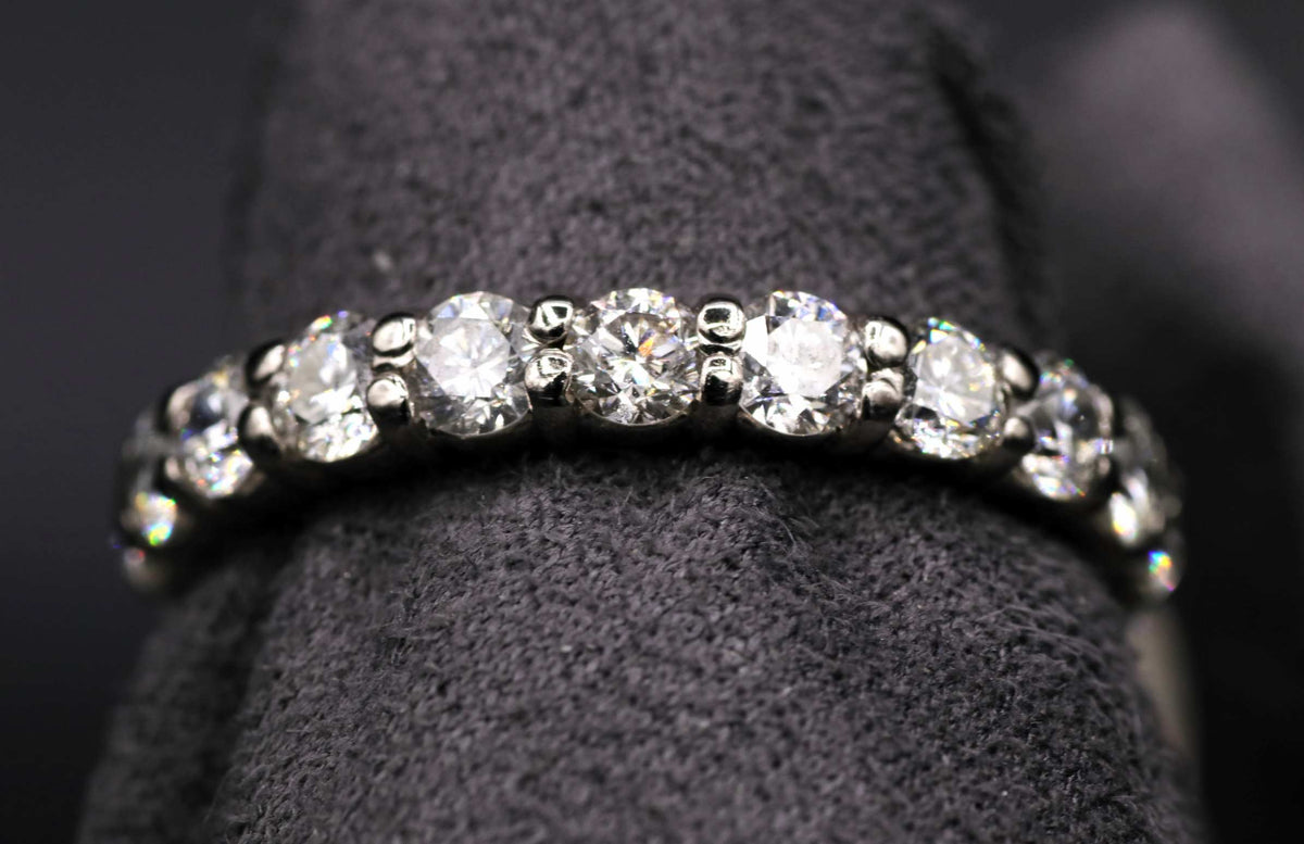 Ladies 18k white gold shared prong diamond eternity ring