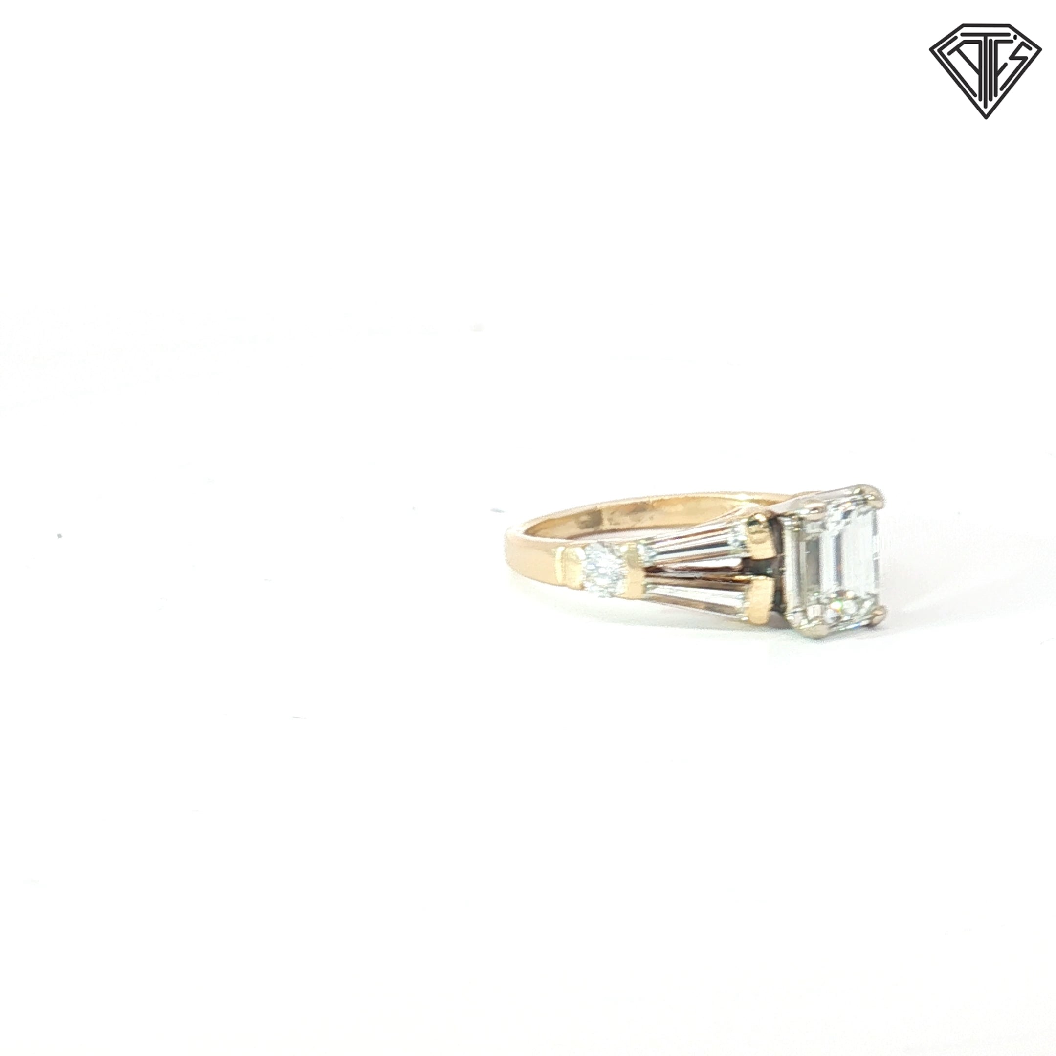 14k Two Tone 1.00ct I VS1 Emerald Cut Diamond/ (2)  .50ct E VS2 Tapered Baguette Shape  Diamond and (2) .25ct E VS2 Round Diamond  Engagement Ring Size 7 Certified By GIA #2223349315