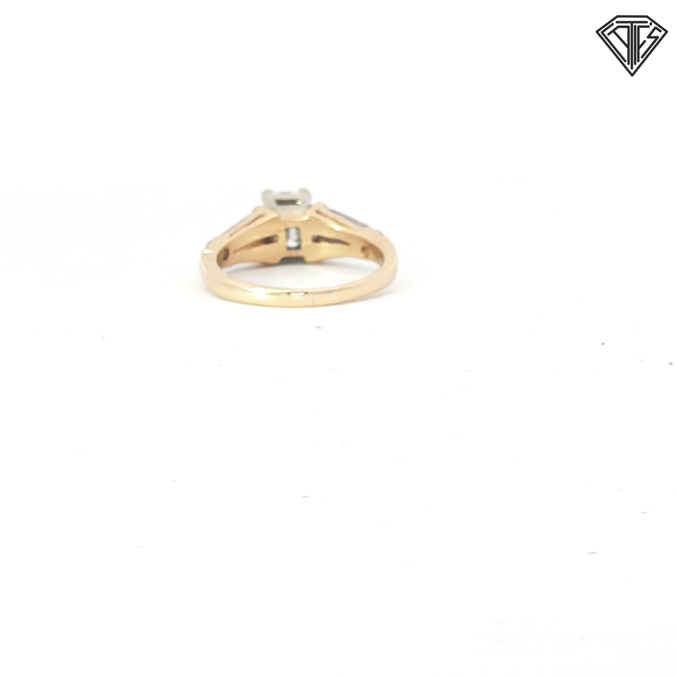 14k Two Tone 1.00ct I VS1 Emerald Cut Diamond/ (2)  .50ct E VS2 Tapered Baguette Shape  Diamond and (2) .25ct E VS2 Round Diamond  Engagement Ring Size 7 Certified By GIA #2223349315