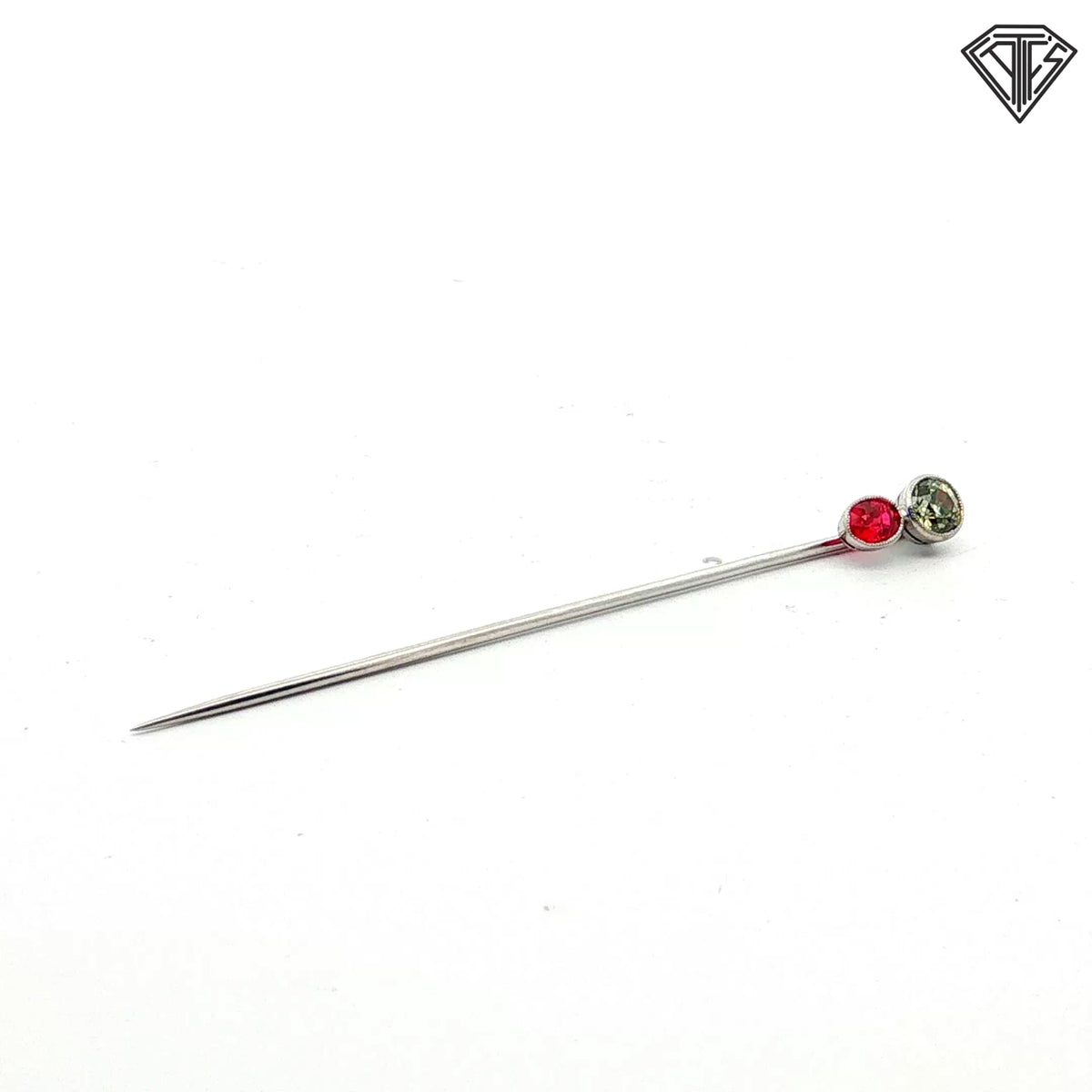 Platinum Stick pin with an approximately .50ct natural Chameleon Diamond Certified By GIA # 2245012586 accompanied by a synthetic ruby