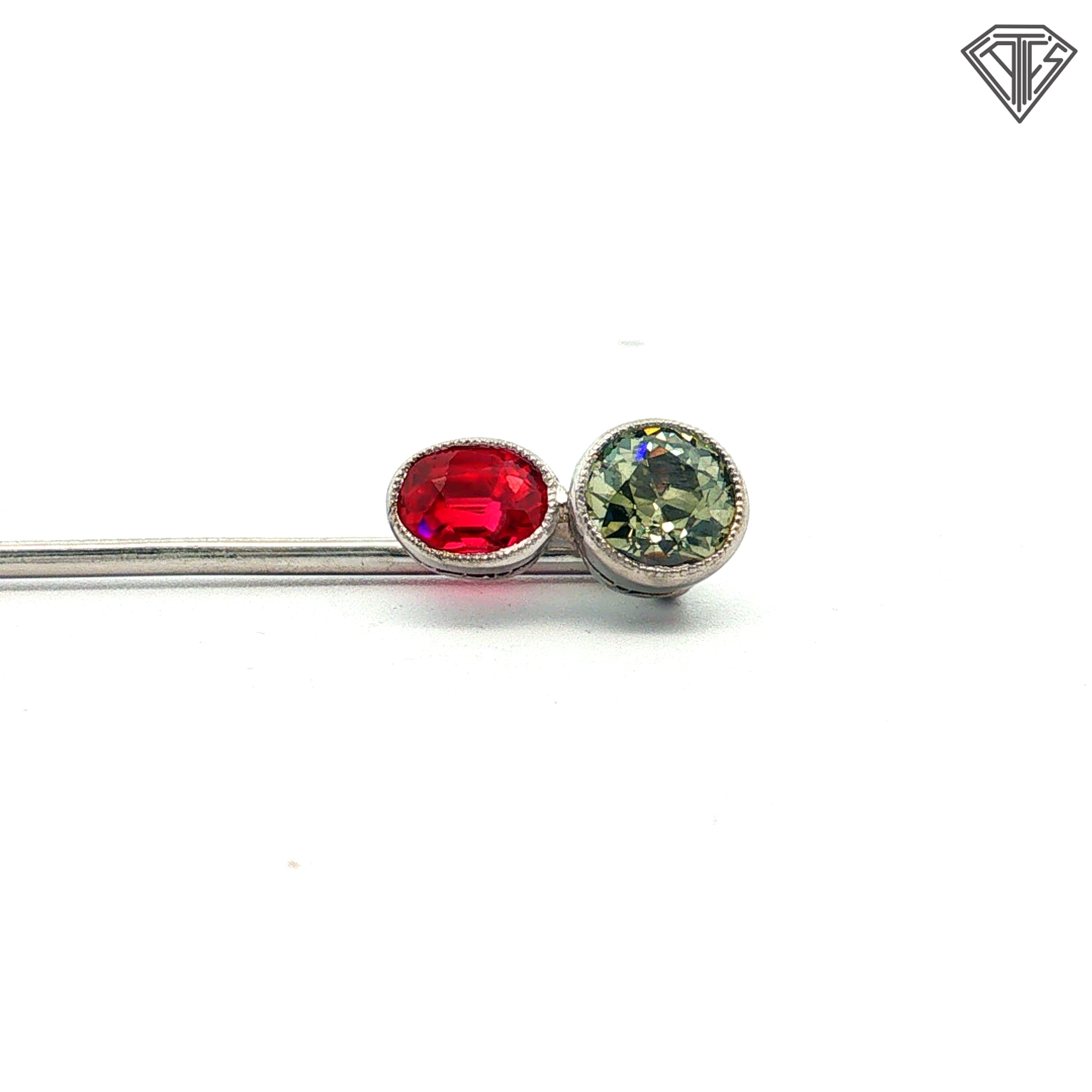 Platinum Stick pin with an approximately .50ct natural Chameleon Diamond Certified By GIA # 2245012586 accompanied by a synthetic ruby