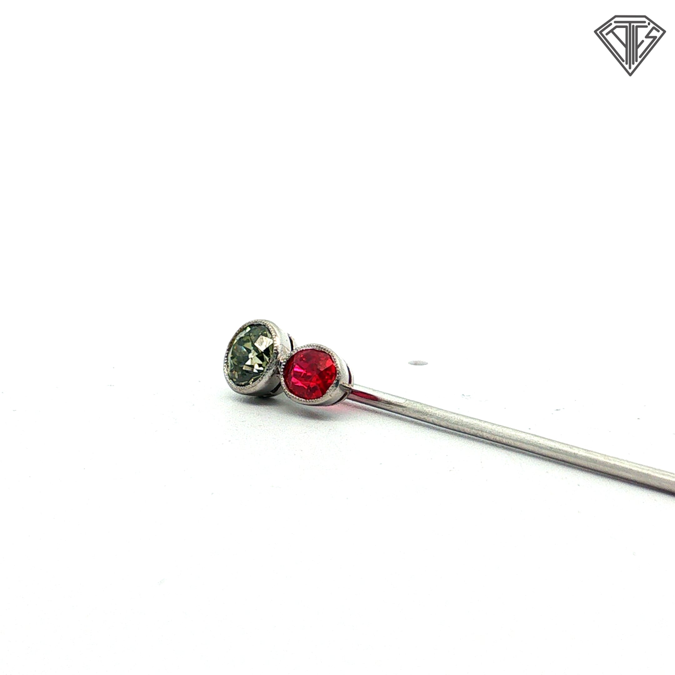 Platinum Stick pin with an approximately .50ct natural Chameleon Diamond Certified By GIA # 2245012586 accompanied by a synthetic ruby