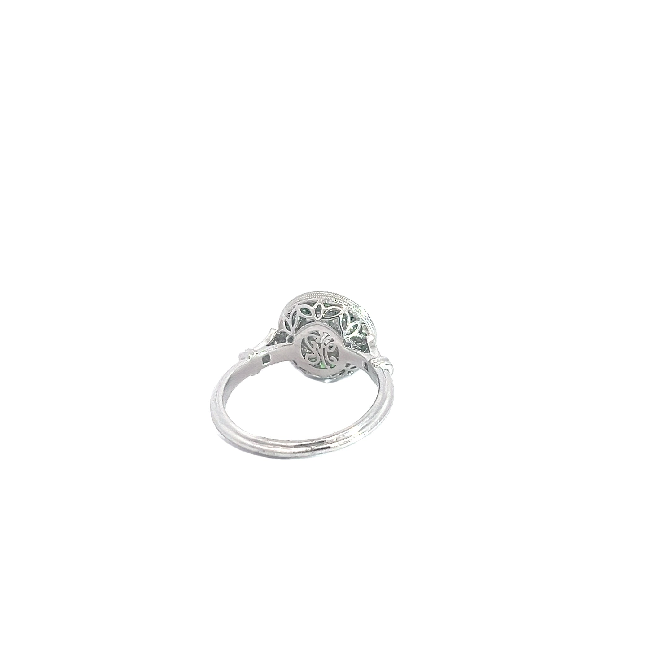 PLATINUM 1.00ct I SI2 Round Diamond Center Stone , .70ct Princess Cut Tsavorite on the halo and  along the band .06ct  Round Diamond Certified by GIA #7453028986