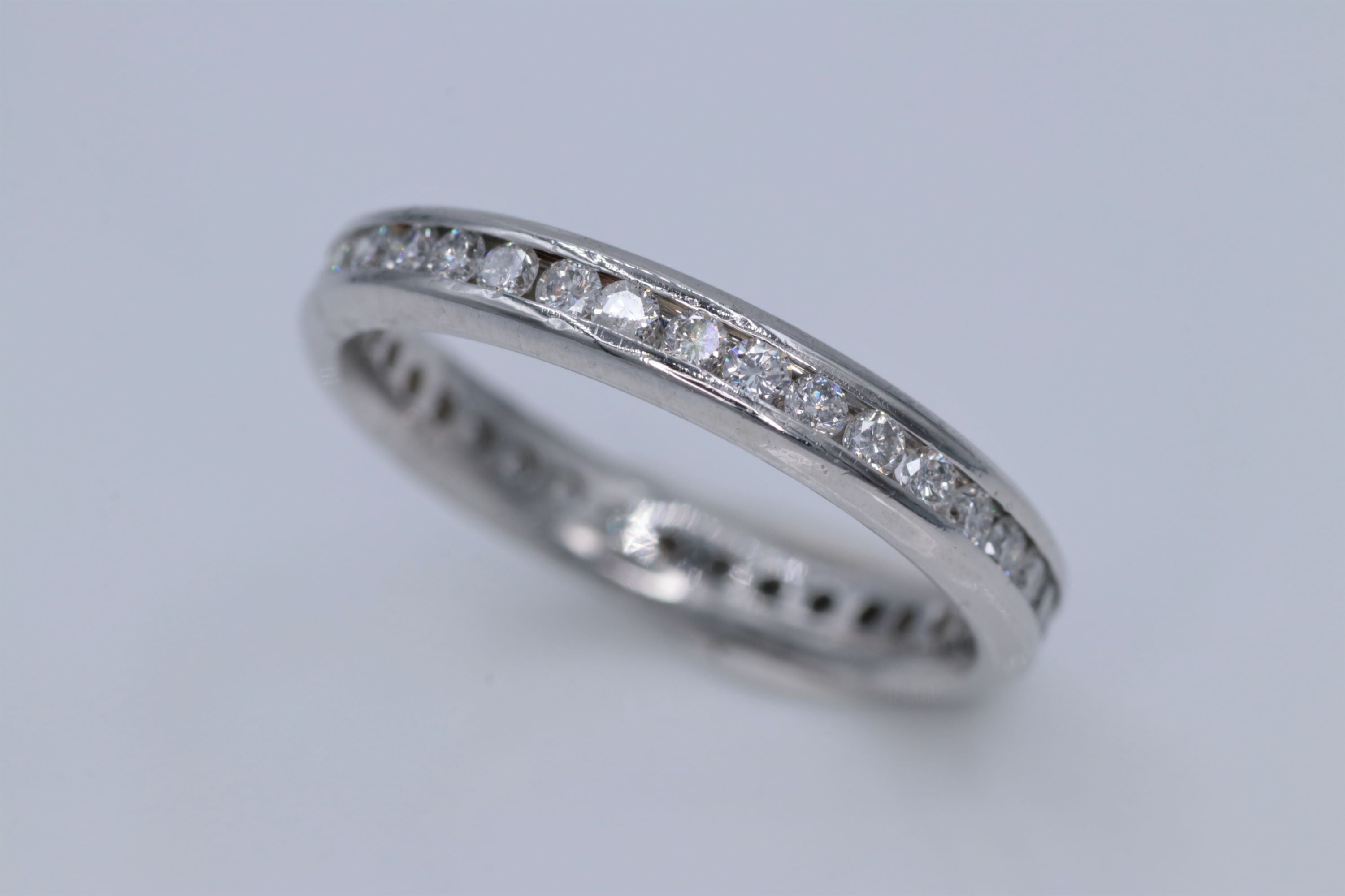 Ladies Platinum channel set diamond eternity ring
