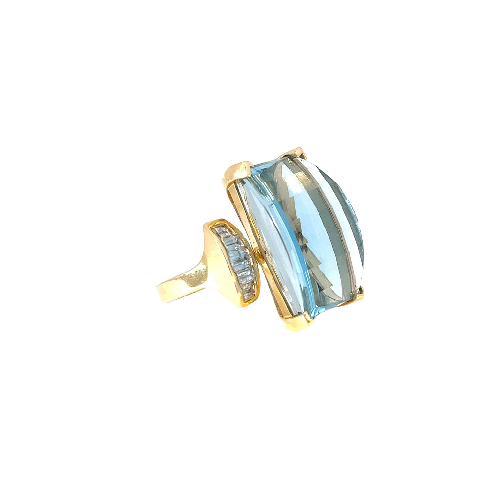 14k Yellow Gold 38.00ct Emerald Cut Blue Topaz and .85ct G SI1 Baguette Shaped Diamond Ring