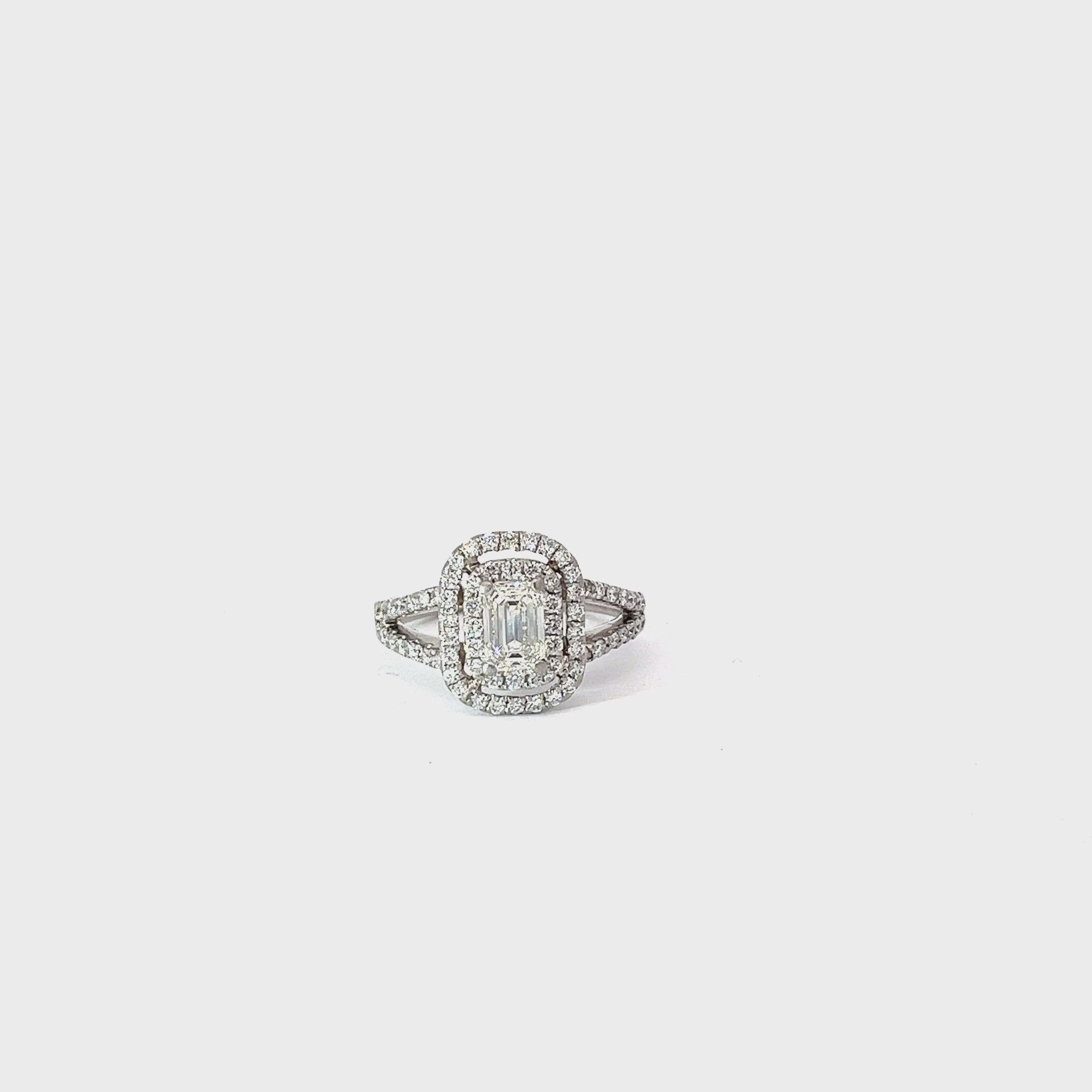 PLATINUM .70CT CENTER EMERALD CUT I VS2 AND .55CT G VS2 DOUBLE HALO SPLIT SHANK ENGAGEMENT RING