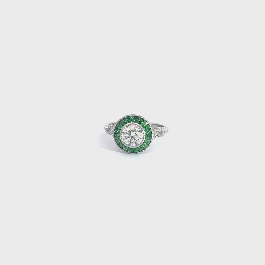 PLATINUM 1.00ct I SI2 Round Diamond Center Stone , .70ct Princess Cut Tsavorite on the halo and  along the band .06ct  Round Diamond Certified by GIA #7453028986