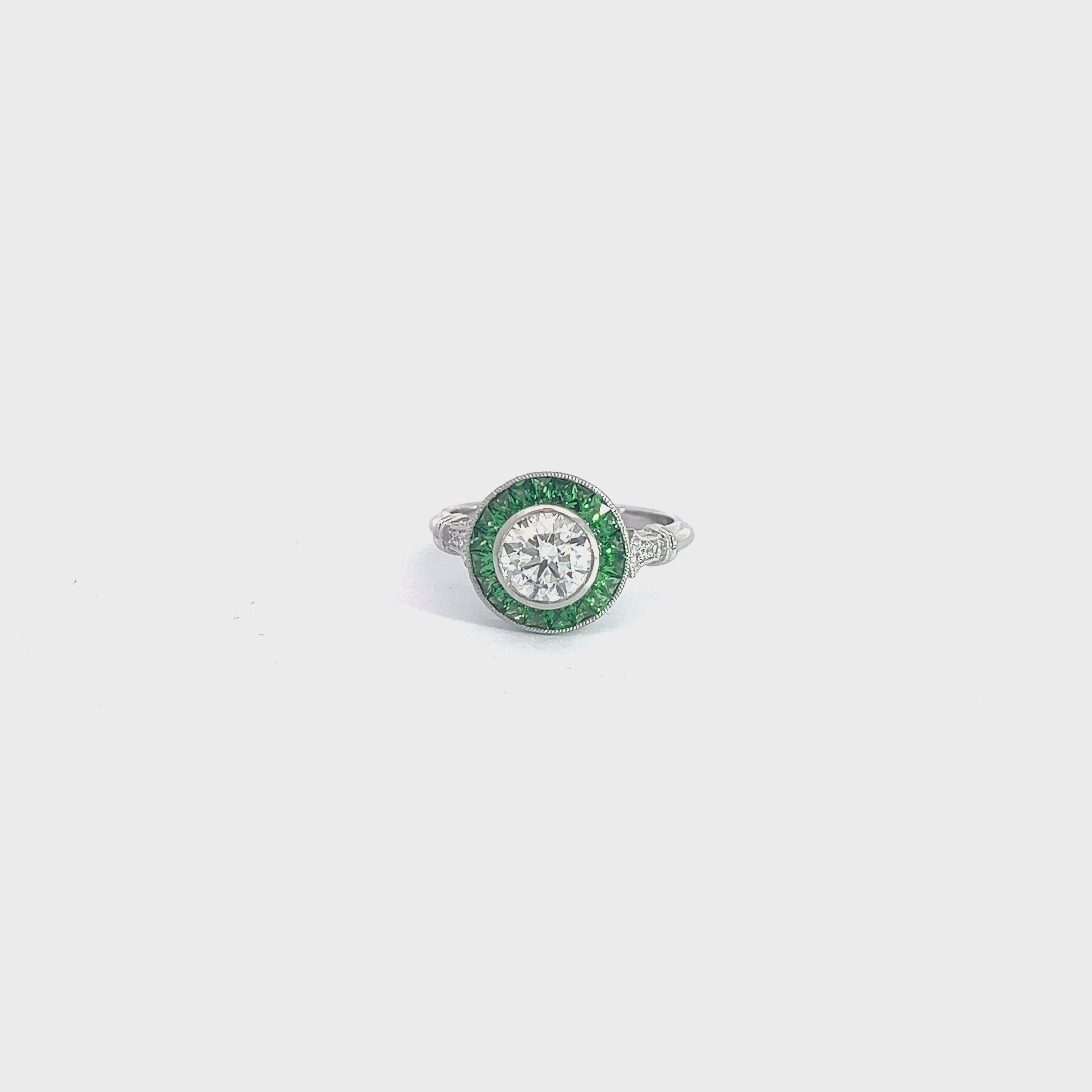 PLATINUM 1.00ct I SI2 Round Diamond Center Stone , .70ct Princess Cut Tsavorite on the halo and  along the band .06ct  Round Diamond Certified by GIA #7453028986