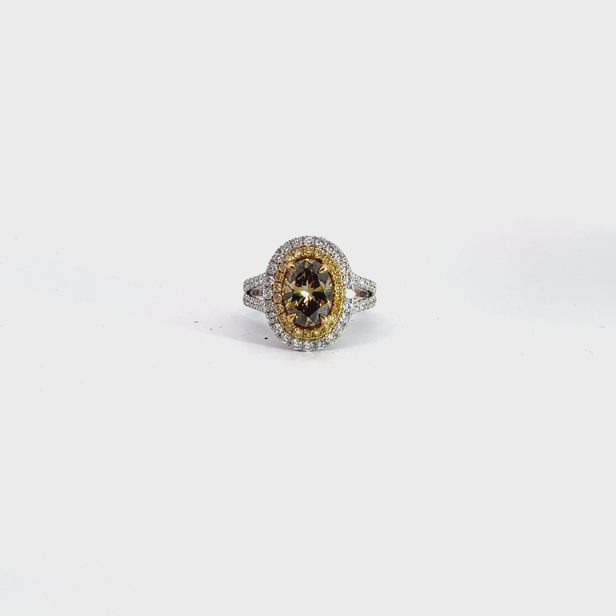 18k Two Toned 1.90ct Oval Shape Fancy Deep Brown Yellow/ .94ct G SI1 Round Diamond and .24ct Round Yellow Diamond Engagement Ring Certified by GIA # 5191234387 Ring