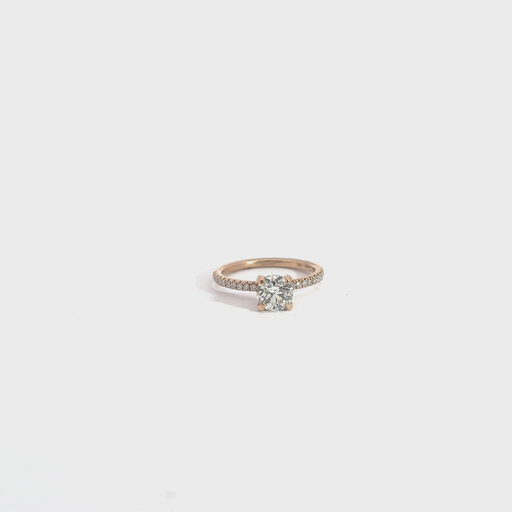 14k Rose Gold 1.01ct  J SI2 Round Diamond Center Stone and .25ct G VS2 Round Diamond along the sides of the engagement Ring. Certified by IGI #375936977