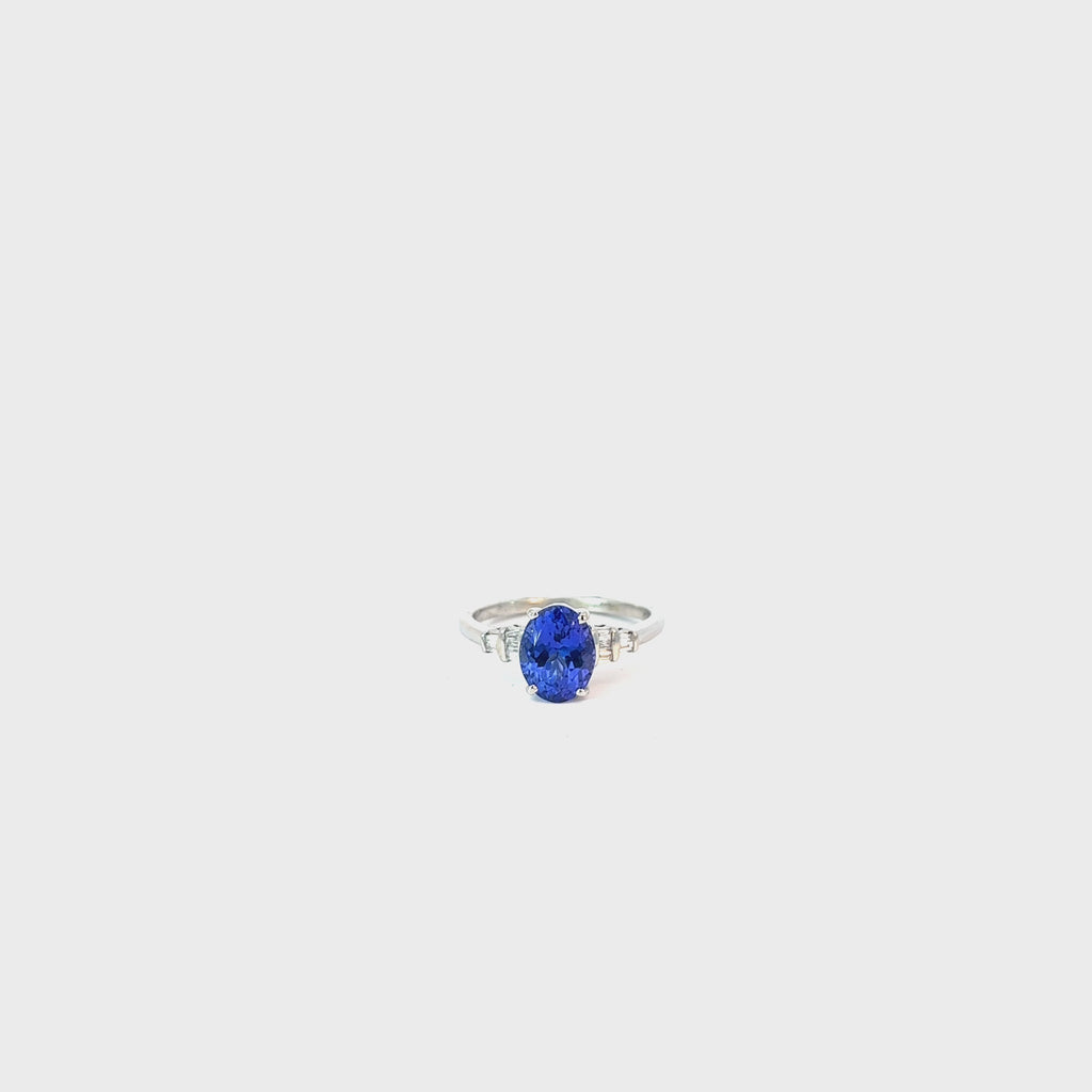 Platinum 1.75ct Oval Tanzanite AAA and .10ct F VS2 Baguette Diamond Ring