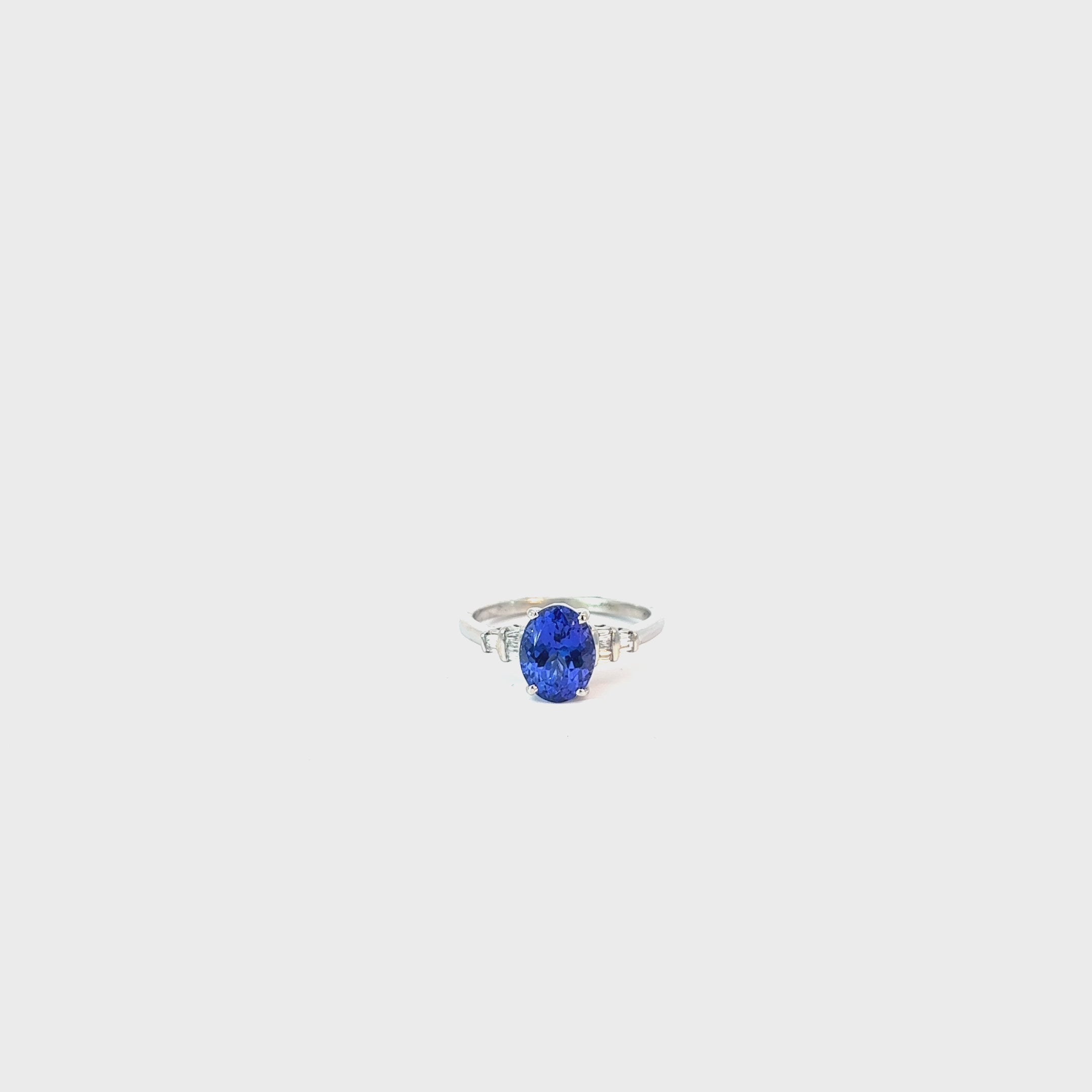 Platinum 1.75ct Oval Tanzanite AAA and .10ct F VS2 Baguette Diamond Ring