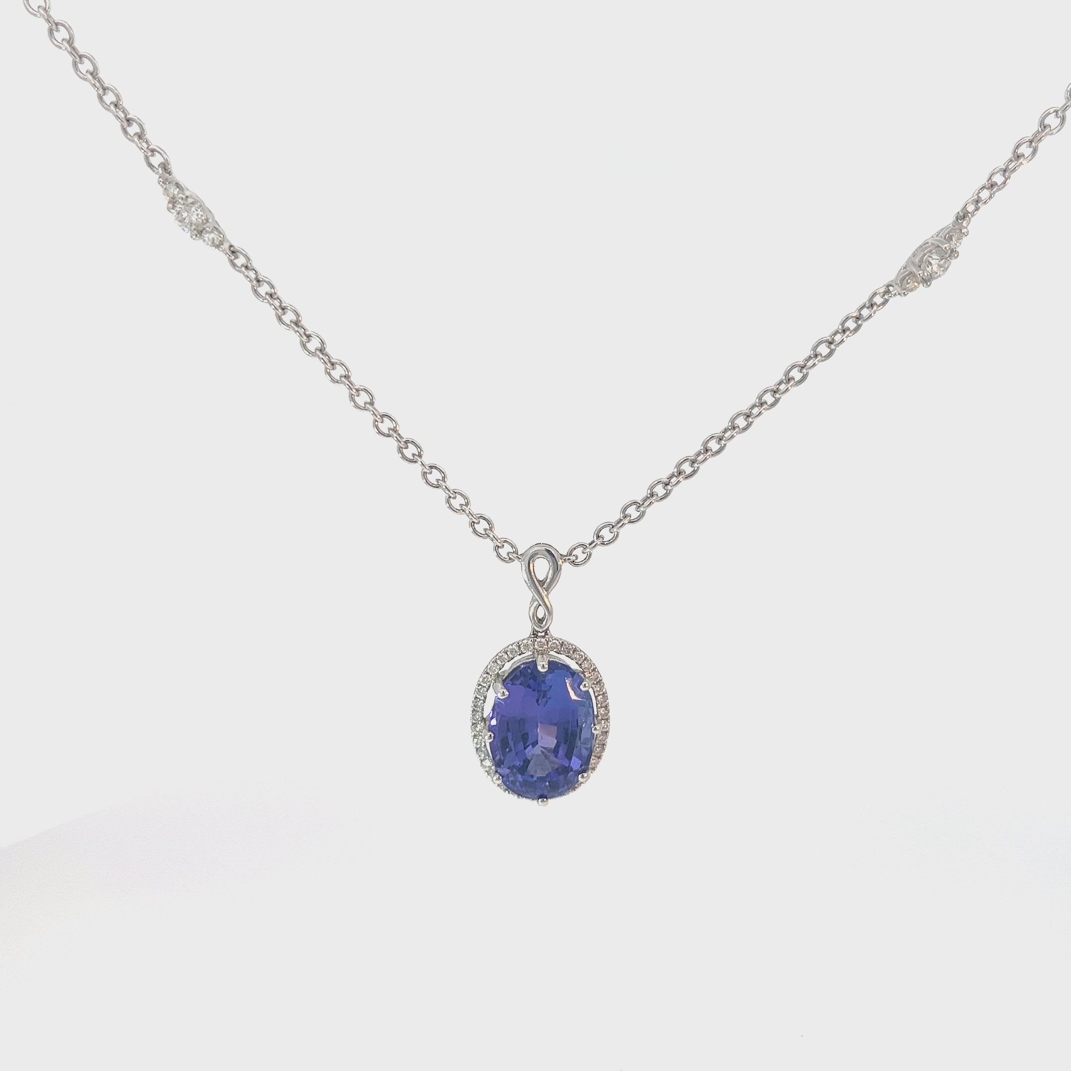 18k White Gold 7.60ct Oval Shape Tanzanite and .75ct G SI1 Round Diamond Necklace