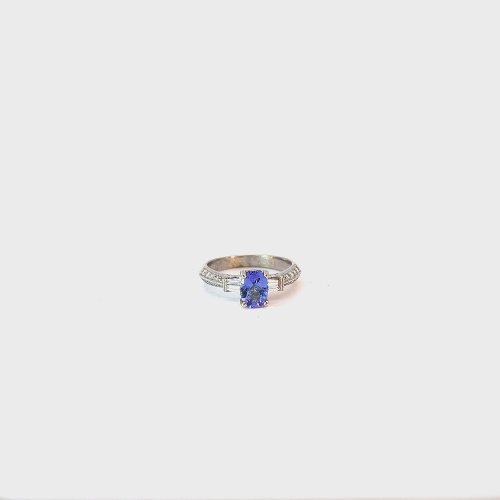 14k White Gold .75ct Oval Tanzanite and surround by .34ct F VS2 Round and Baguette Total Weight Diamond  Ring