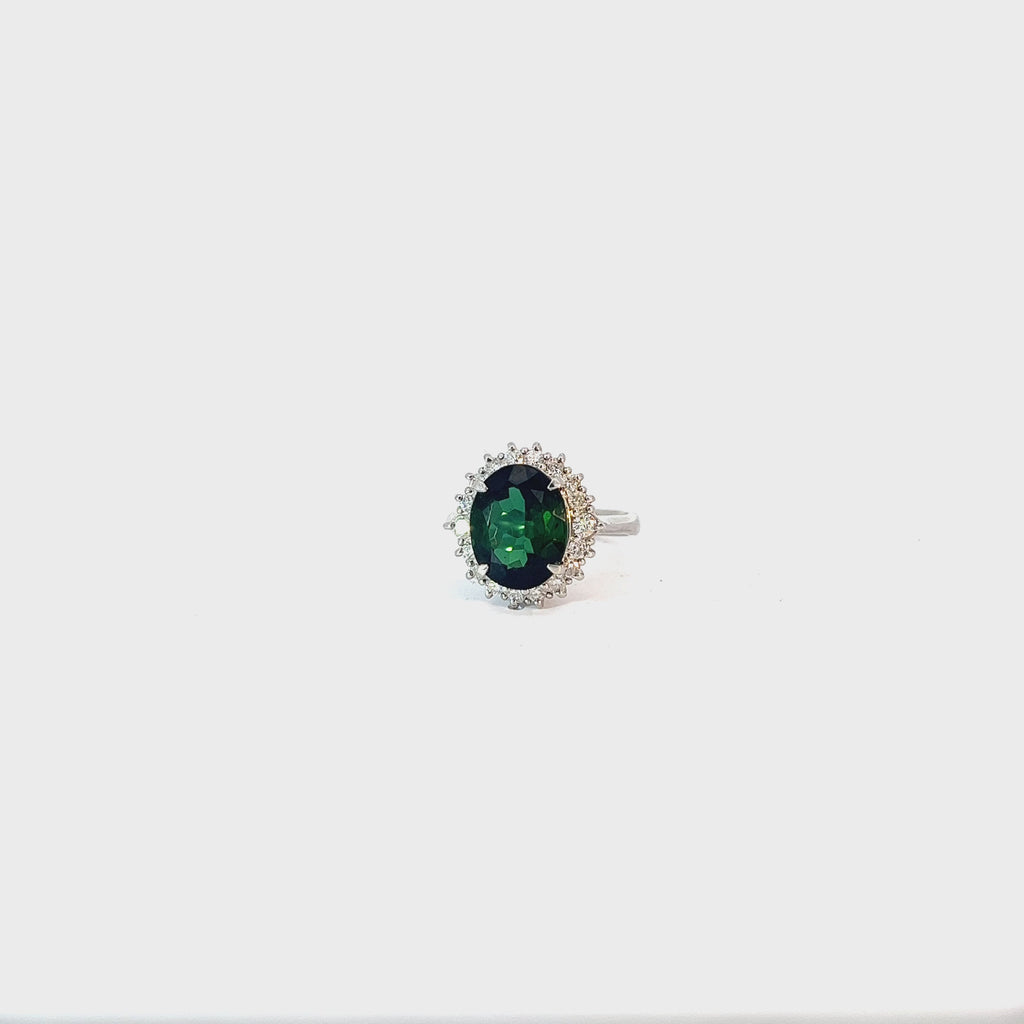 Platinum 4.04ct Oval  AAA Green Tourmaline and surround by the halo .50ct G SI1 Round Diamond ring