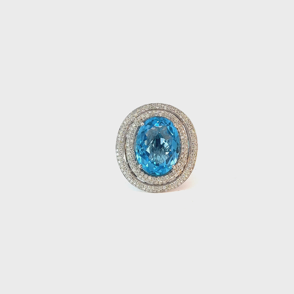 14k White Gold 8.00ct Oval Shaped Blue Topaz and 1.00ct F VS2 Round Diamond Ring