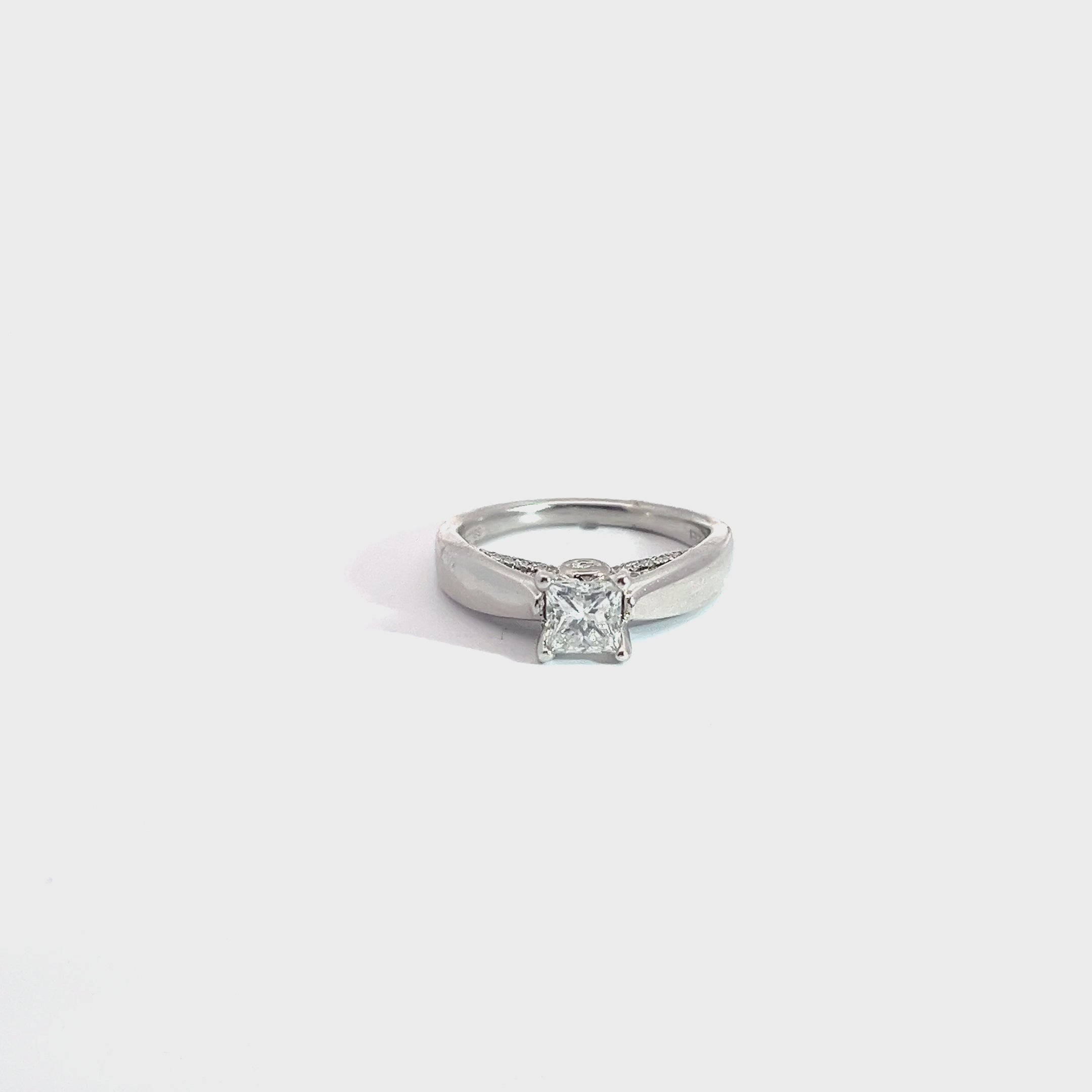 14k white gold 1.00ct G SI1 Princess Cut Diamond and .15ct G SI1 Round diamond under basket mounting engagement ring