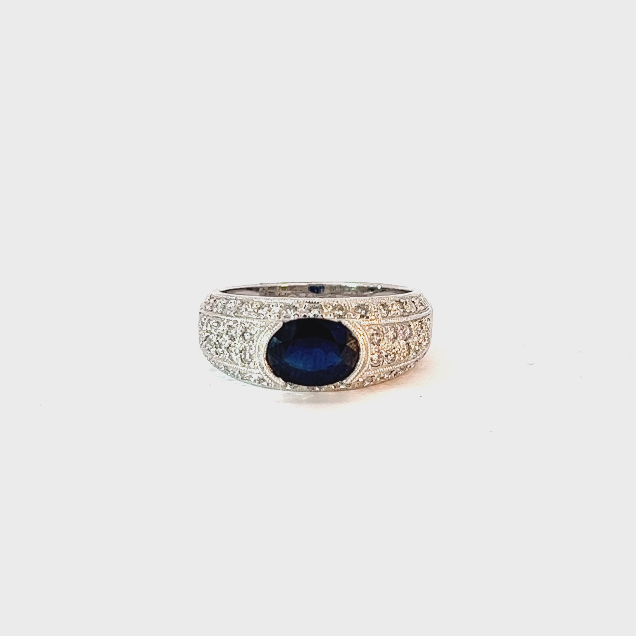 14k White Gold 1.50ct Center Oval  Blue Sapphire and surround by .50ct F VS2 Round Ring