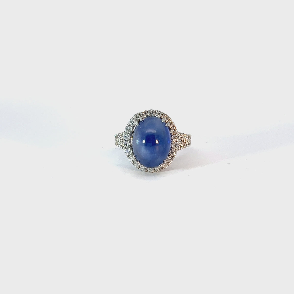 18k White Gold 6.75ct Oval Star Sapphire and 1.10ct F VS2 Round Ring