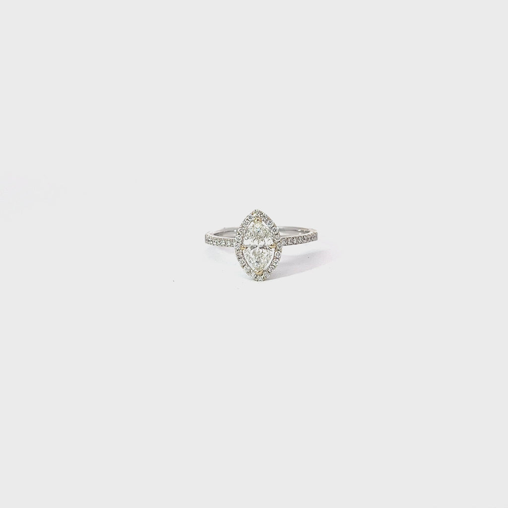 18k White Gold .72ct I SI2 Marquise Shaped Diamond and .25ct along the side and Halo of the Engagement Ring Certified by IGI #33561314 Size 5 1/2