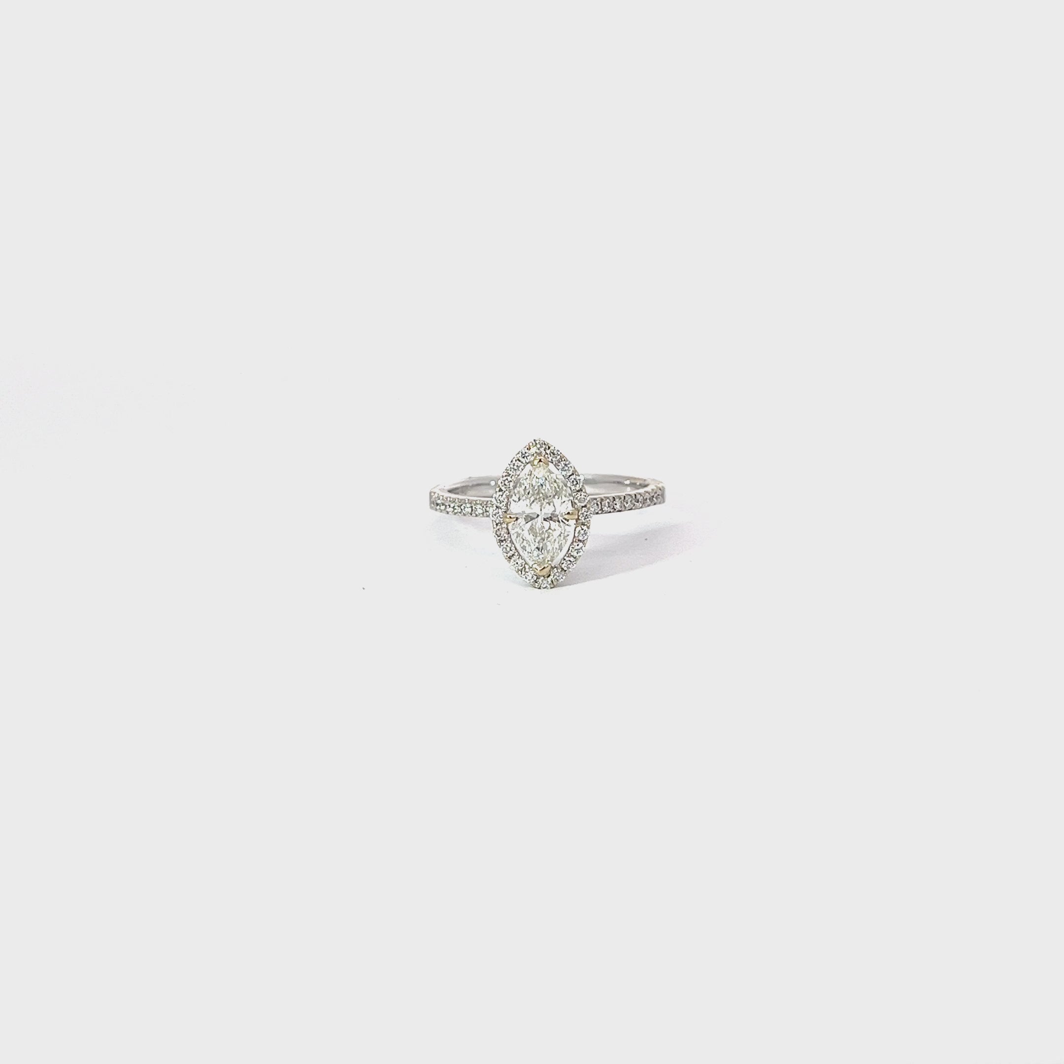 18k White Gold .72ct I SI2 Marquise Shaped Diamond and .25ct along the side and Halo of the Engagement Ring Certified by IGI #33561314 Size 5 1/2
