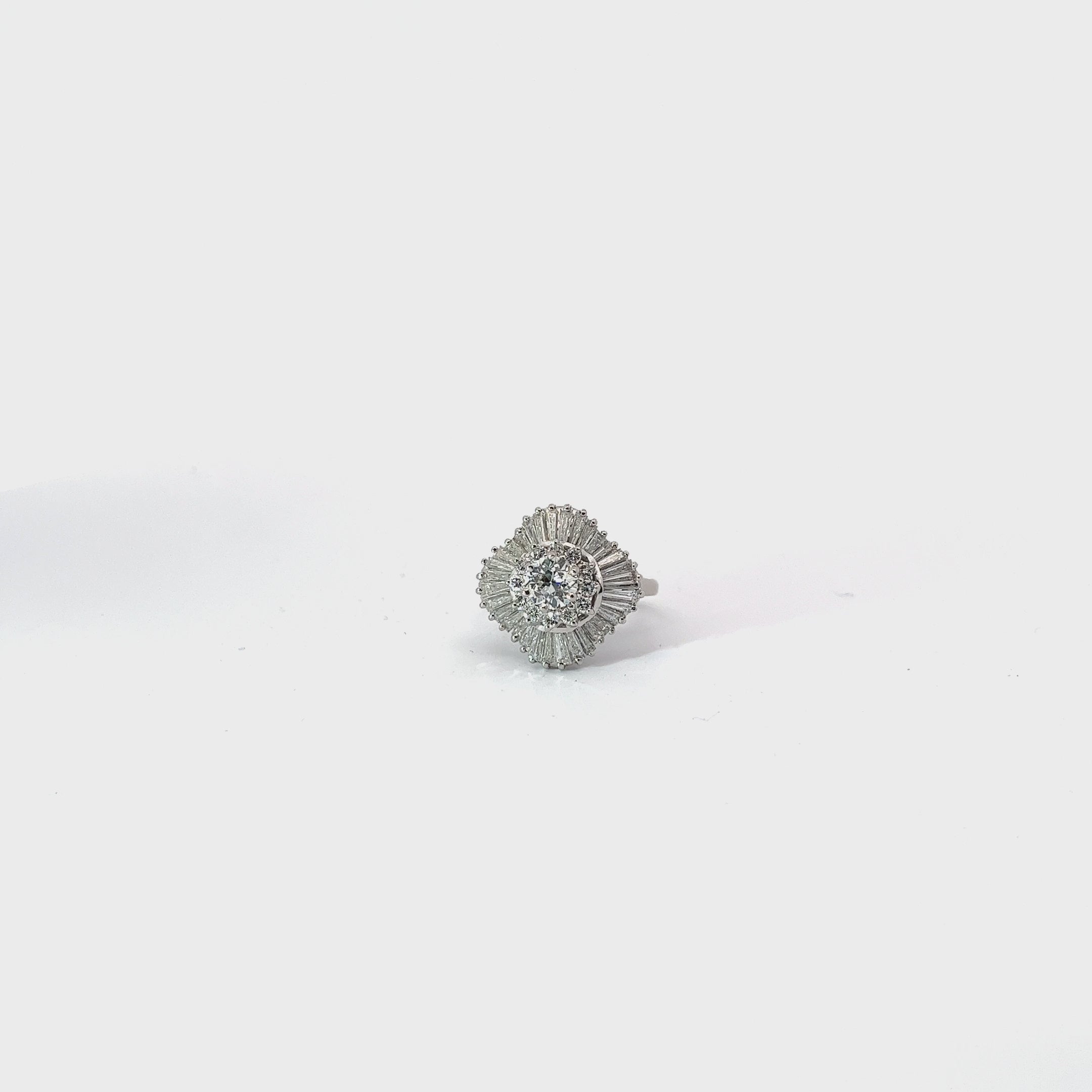 Platinum .50ct Center stone and 1.50ct surrounded E VS2 Baguette and Round Total Weight of diamond  Ballerina Fashion ring