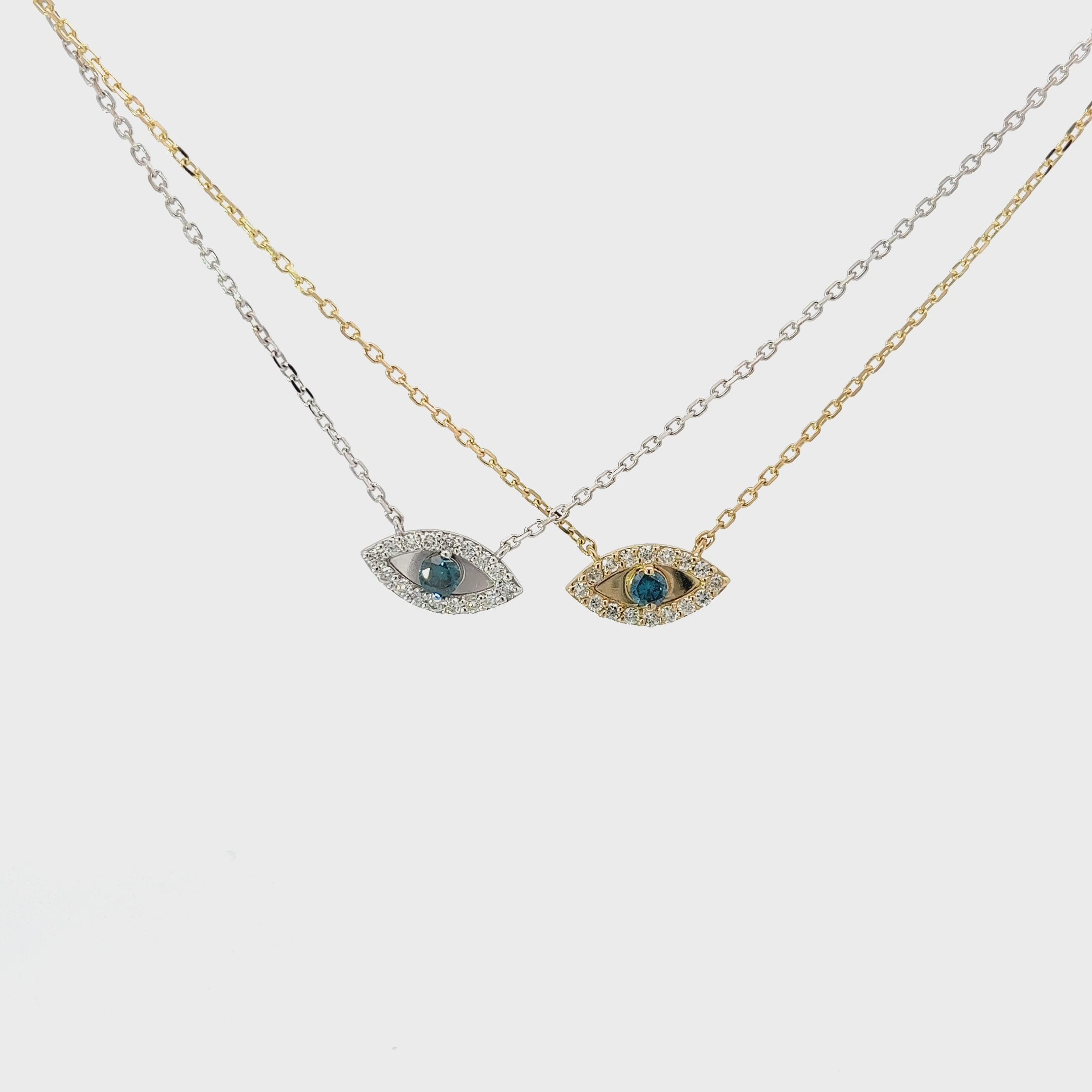 14K YELLOW AND WHITE GOLD .20ct G SI2 ROUND DIAMOND AND .12Cct BLUE DIAMOND EVIL EYE PENDANT
