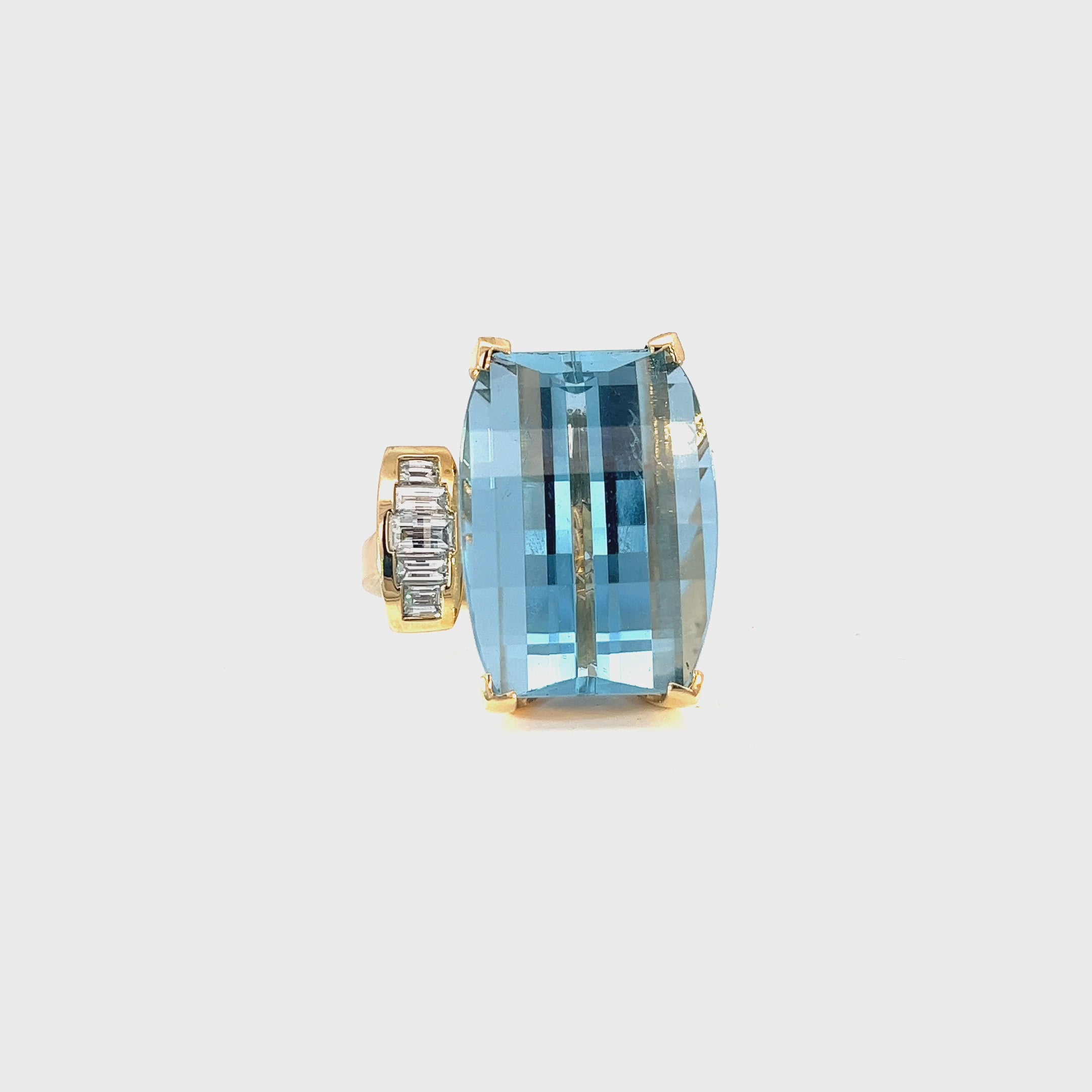 14k Yellow Gold 38.00ct Emerald Cut Blue Topaz and .85ct G SI1 Baguette Shaped Diamond Ring