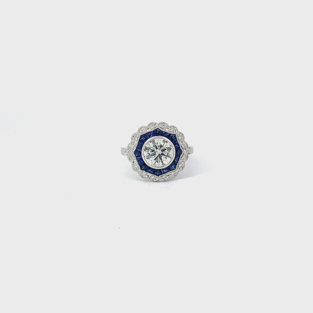 18K WHITE GOLD 1.41CT M VS2 ROUND CENTER DIAMOND AND 1.00CT BLUE SAPPHIRE ON THE HALO /.20CT DIAMOND FOR 1.50CT ROUND DIAMOND ON THE HALO 9.02MM