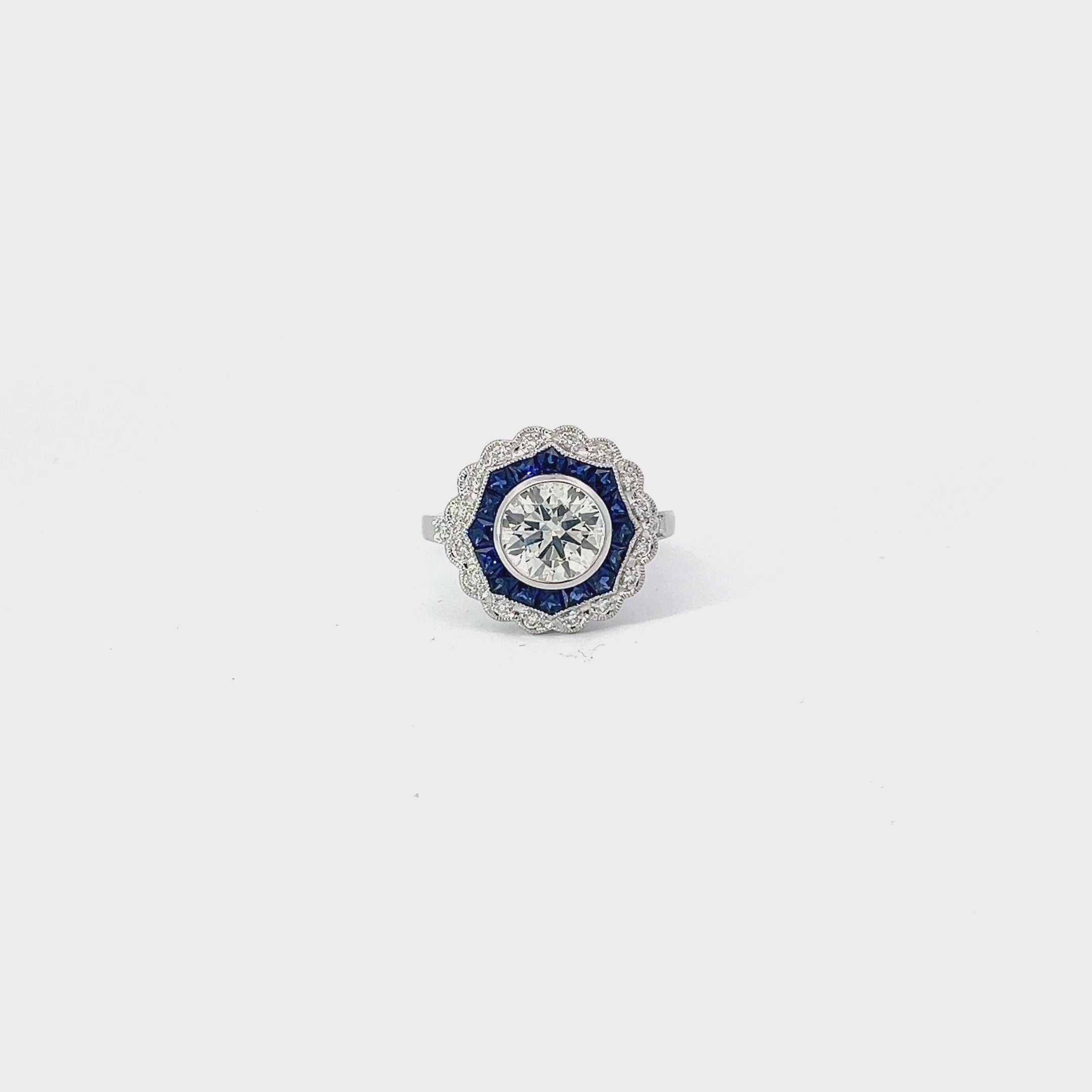 18K WHITE GOLD 1.41CT M VS2 ROUND CENTER DIAMOND AND 1.00CT BLUE SAPPHIRE ON THE HALO /.20CT DIAMOND FOR 1.50CT ROUND DIAMOND ON THE HALO 9.02MM