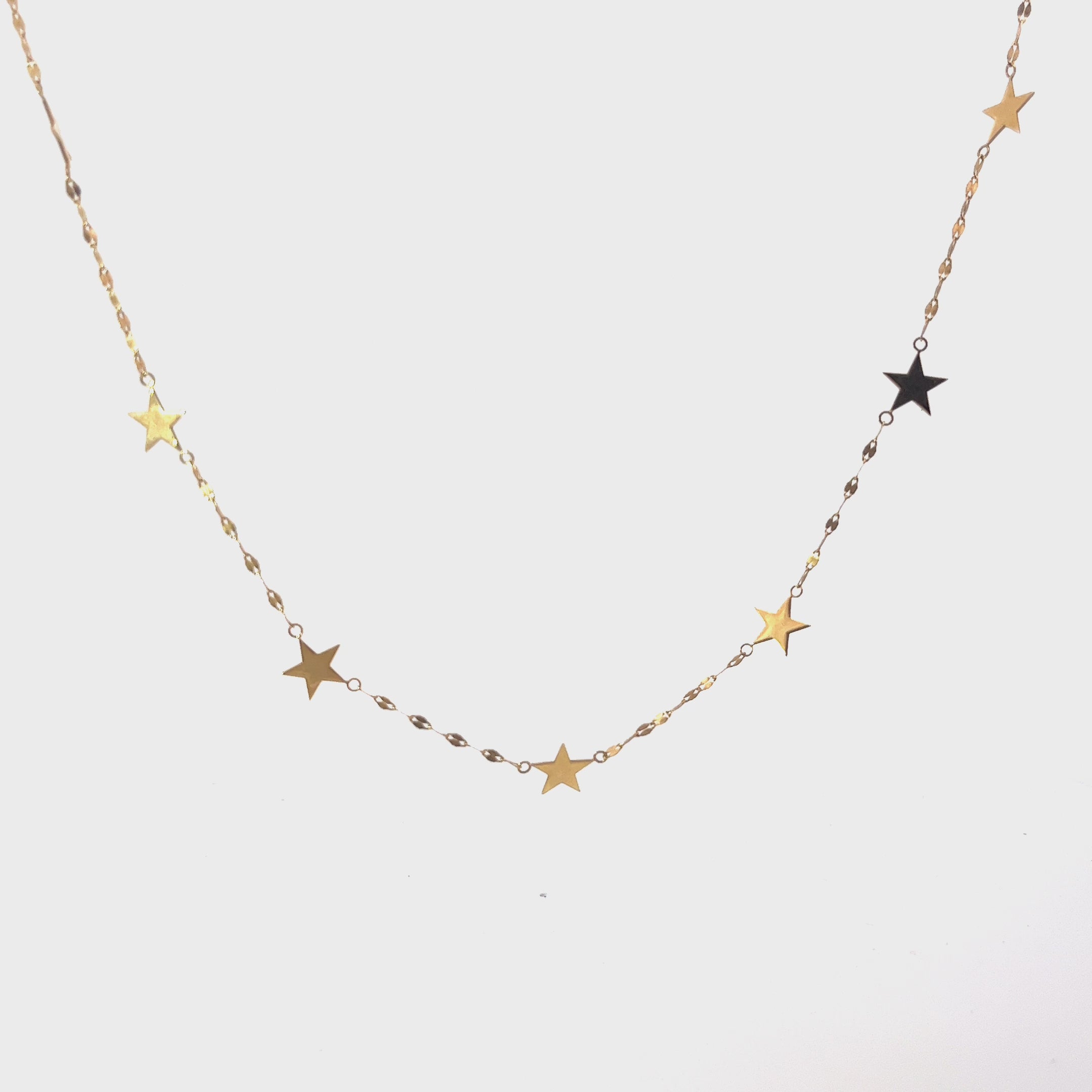 Ladies 14k yellow gold Dangle Star necklace.